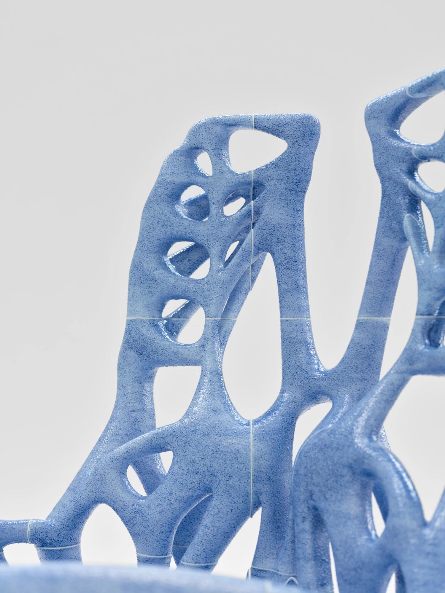 Extrude, Bridge, Fill by Lasse Sylvest Lilleør, photographed by Robert Damisch — Detail of the Rocking Chair, the striated print layers reading up the bone-blue uprights.