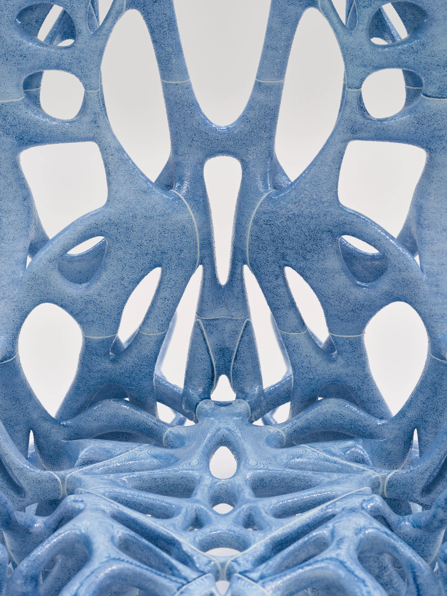Extrude, Bridge, Fill by Lasse Sylvest Lilleør, photographed by Robert Damisch — Macro of the Rocking Chair's lattice, its mirrored openings and layered printed surface.