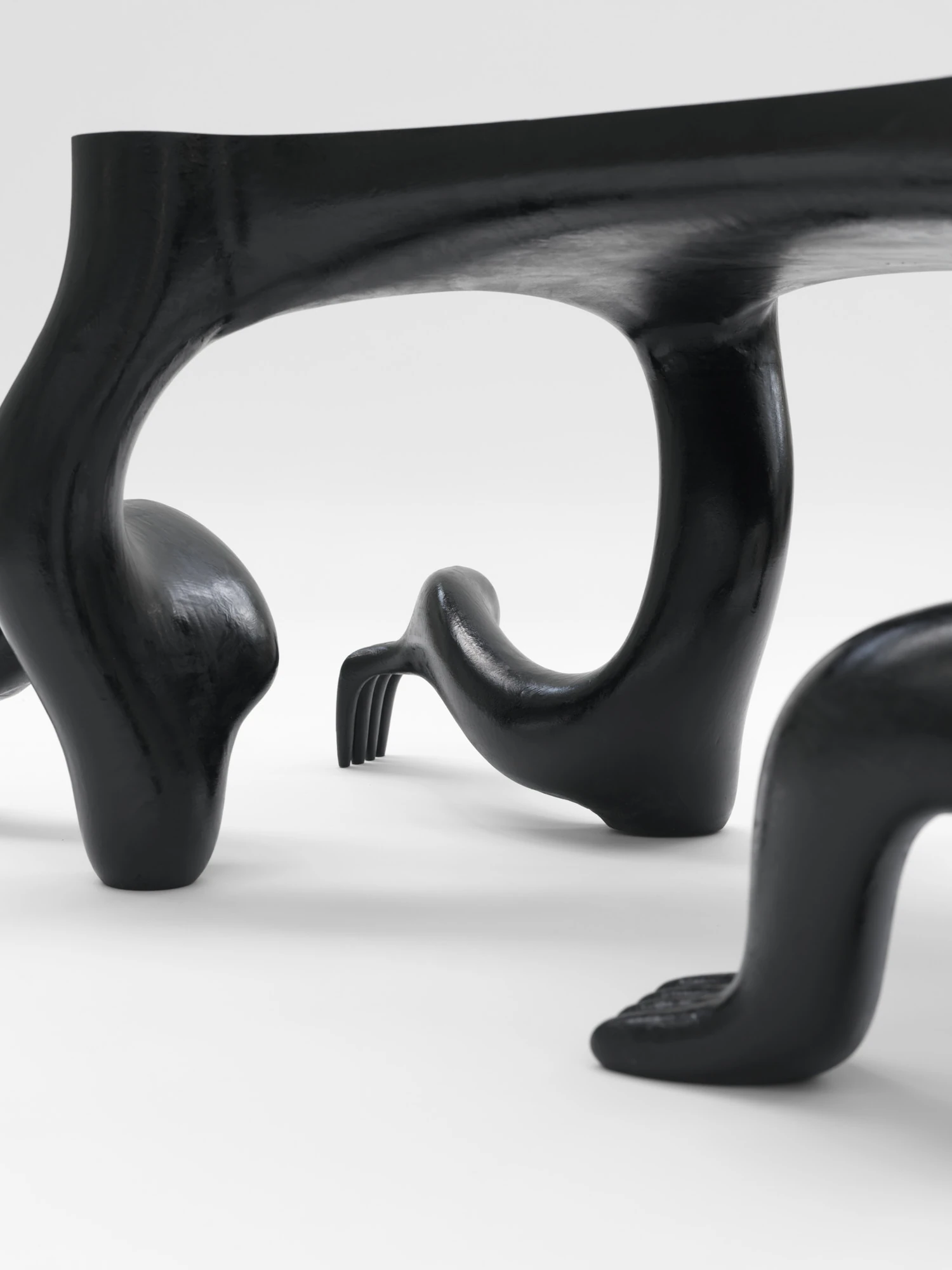 Extrude, Bridge, Fill by Lasse Sylvest Lilleør, photographed by Robert Damisch — Detail of the Crawler Coffee Table, its limbs and splayed fingers meeting the floor.