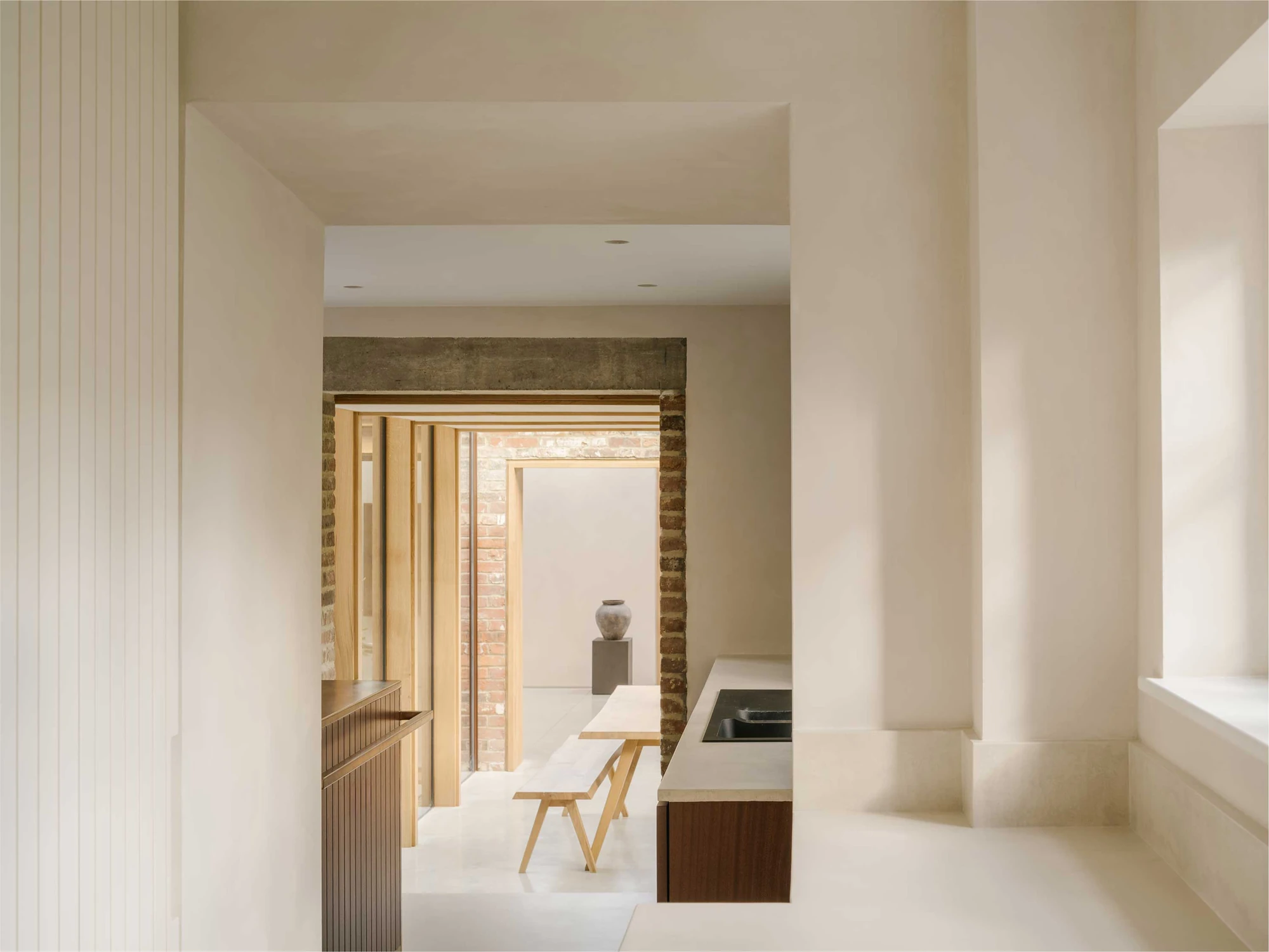 Muttram Veedu by Will Gamble Architects, photographed by James Retief — The cottage stands beside its low reclaimed brick extension, a monopitch roof and glazed link tucked below an old fruit tree.