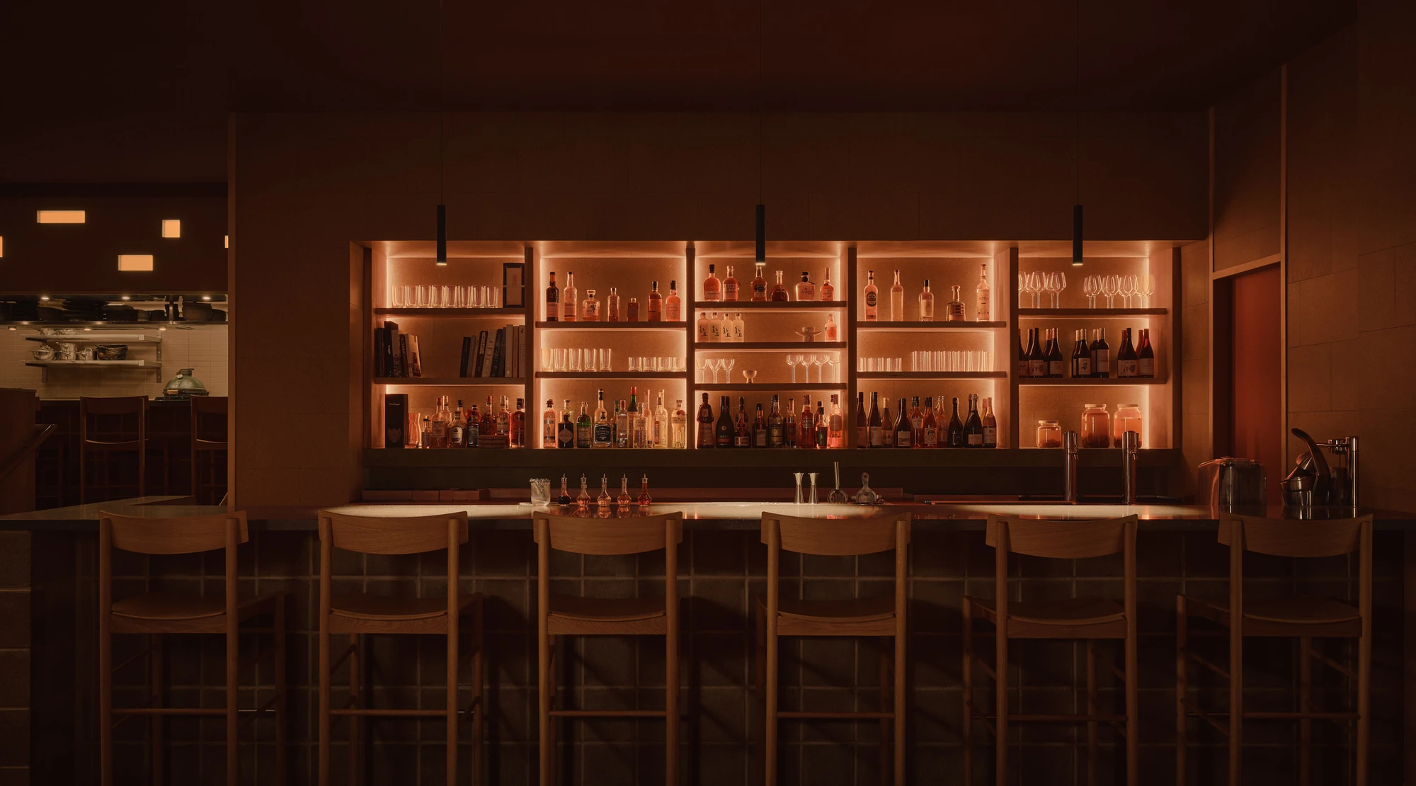 Jeju by &Daughters, photographed by Alex Lesage — The illuminated back bar, timber shelves of bottles and glassware lit from within above a concrete-block bar base.