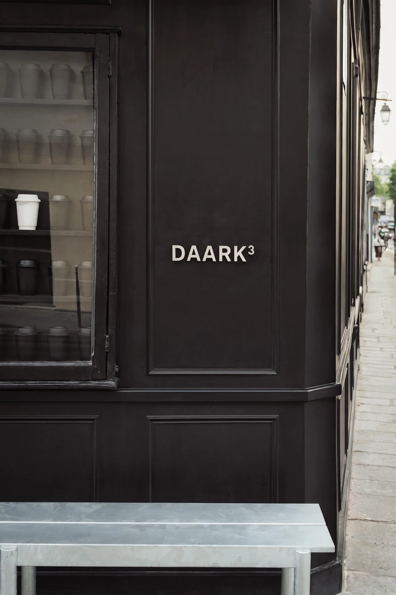 DAARK by Rodaa Studio, photographed by Adrien Ozouf — DAARK signage beside the shop window on rue de Turenne, Paris.