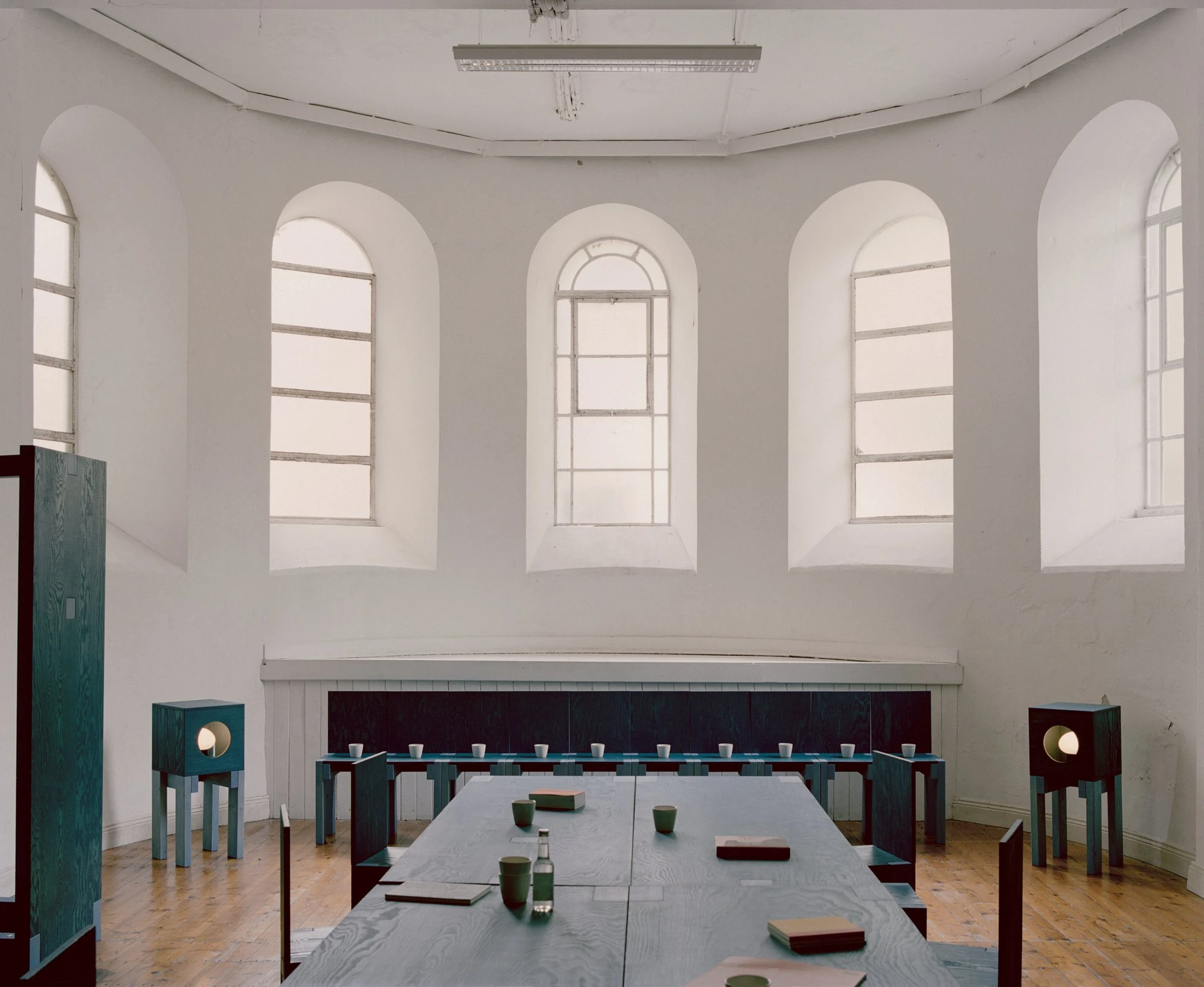 settle by Trestle, photographed by Willem Pab — settle by Trestle, Cork City, 2026, tables and dressers configured for a shared reading.