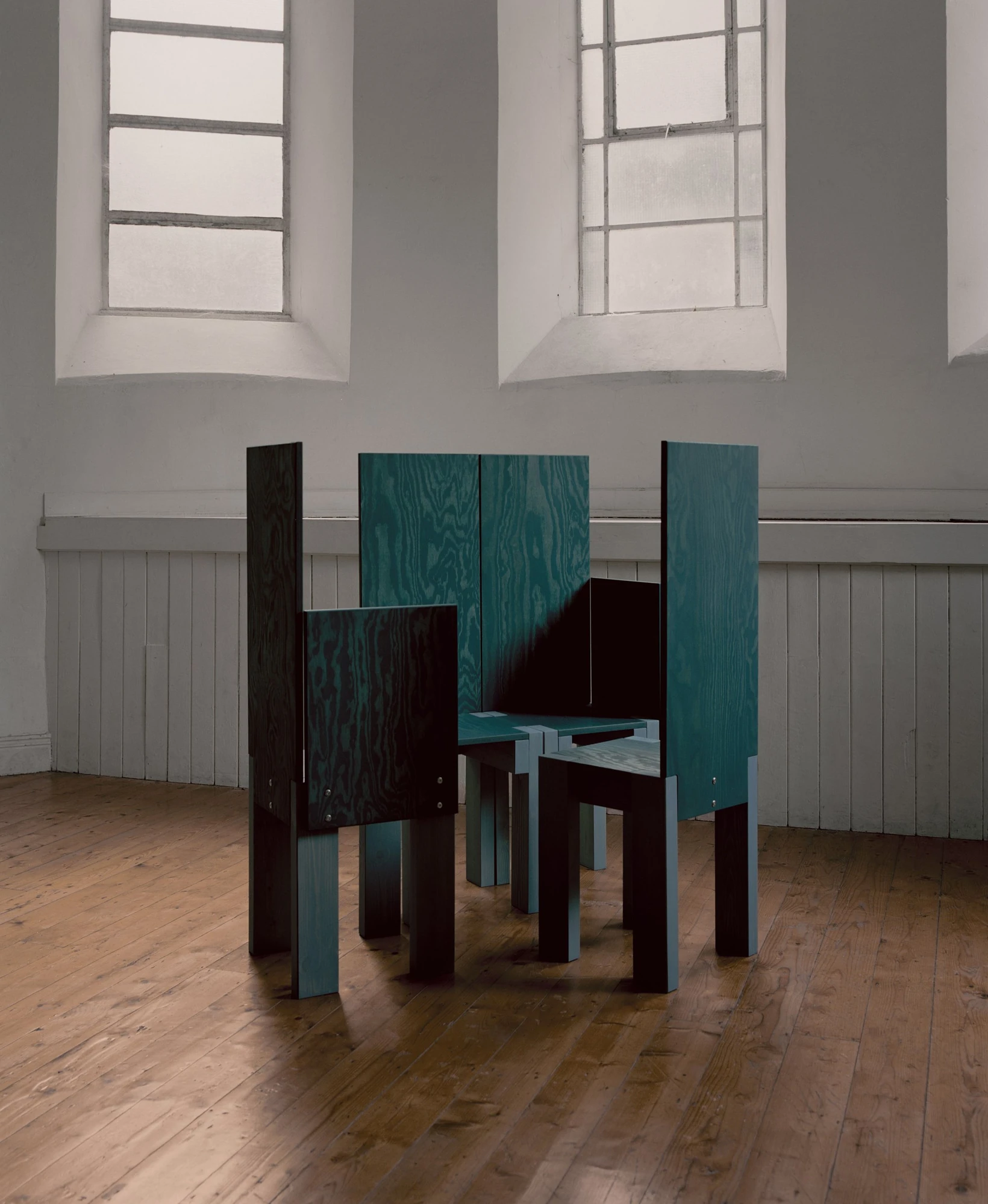 settle by Trestle, photographed by Willem Pab — settle by Trestle, Cork City, 2026, settle beds and benches lined along the wall.