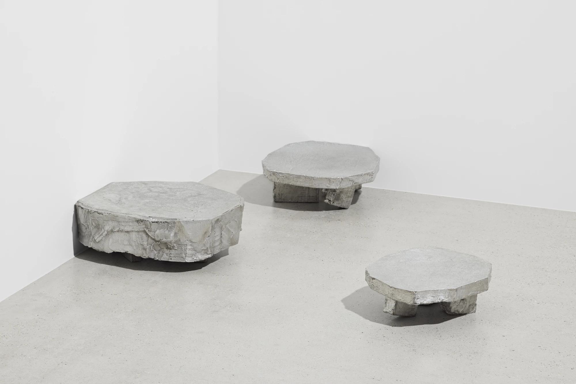 Lying on the floor by StudioFA, photographed by Yongin Myoung — The same three pieces from a second angle, gathered near the corner where wall meets floor.