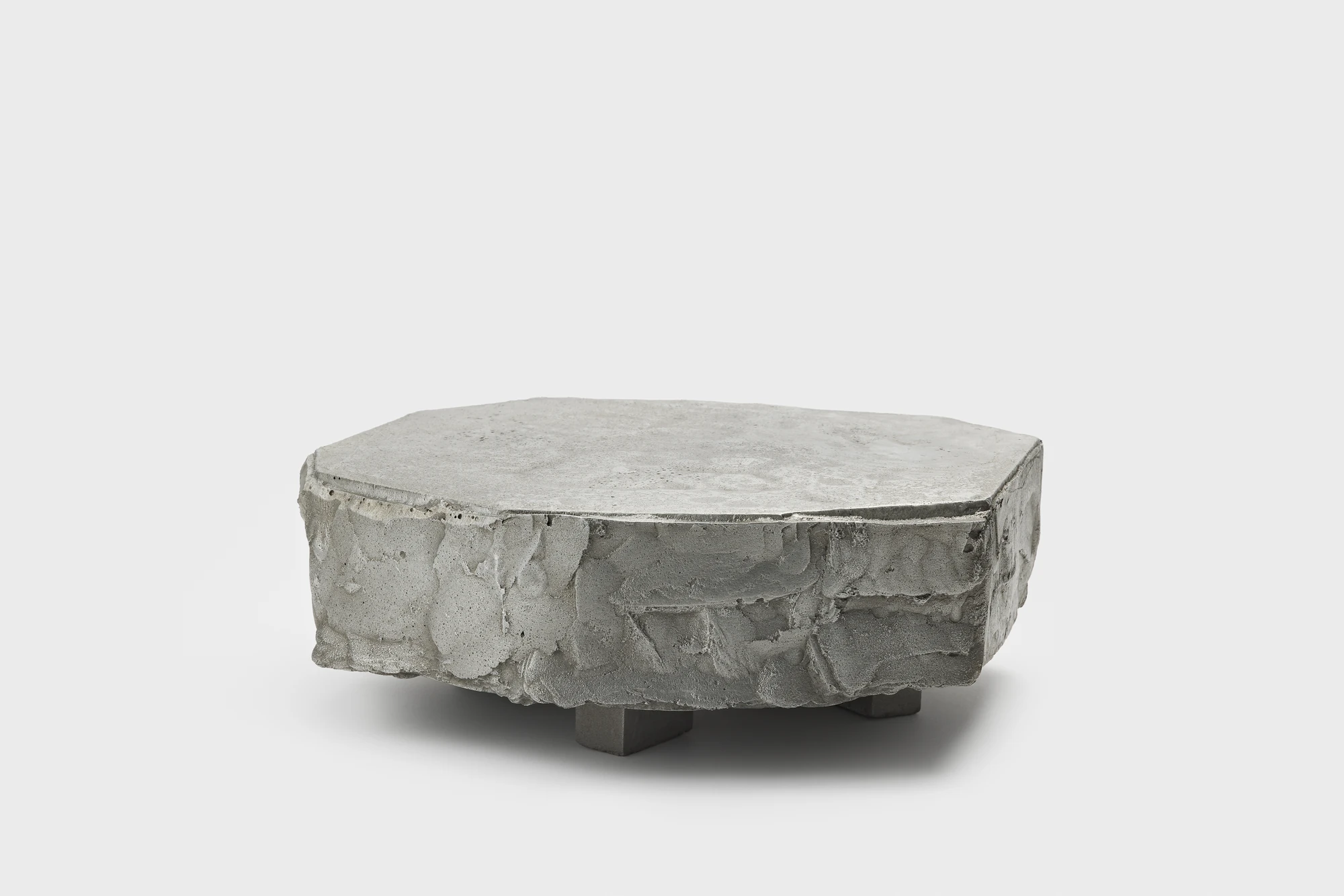 Lying on the floor by StudioFA, photographed by Yongin Myoung — The deepest of the three pieces, a thick cast body sitting on feet barely lifted off the ground.