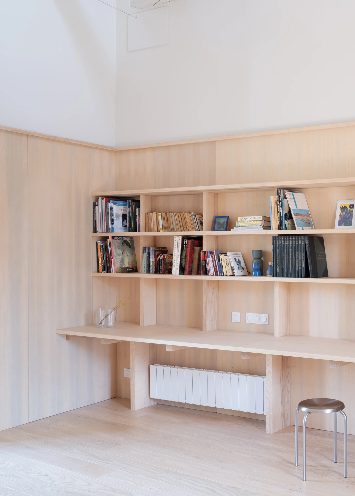 Farmhouse Renovation by Atelier AJO, photographed by Sandrine Iratçabal — The library wall, its shelving and a built-in desk running the length of the room.