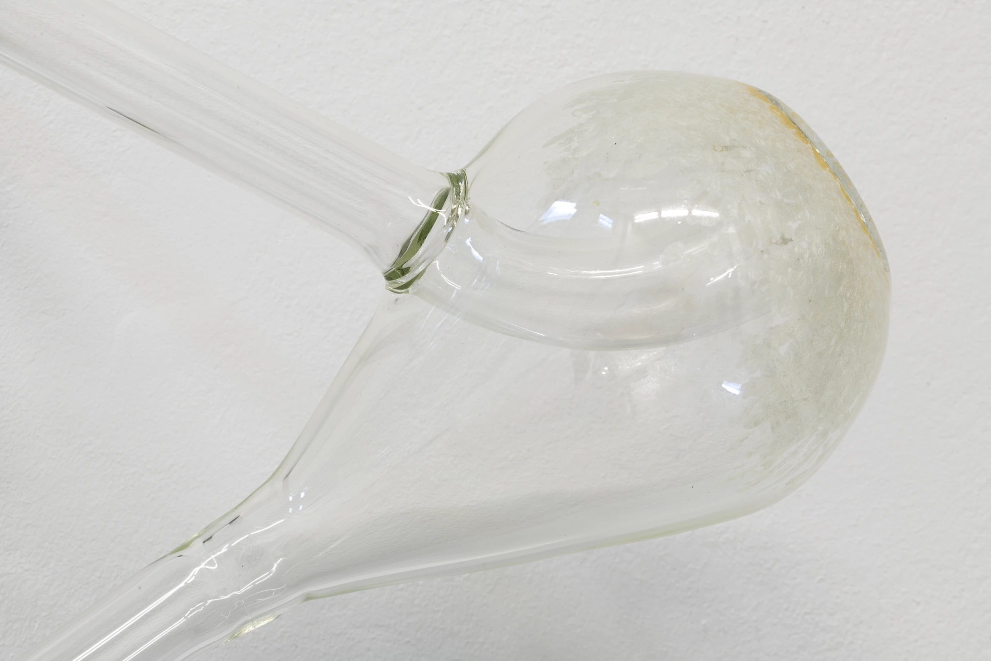 Half-Life of Grace by Jeremy Shaw, photographed by Stefan Korte — Detail of The Distance Between Infinite Folds is Still You, where a flame-worked glass tube meets the swell of a Klein bottle.