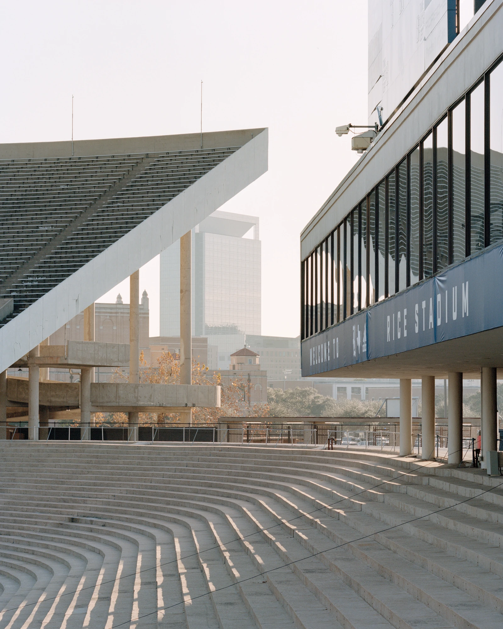 Houston, Untitled by Rory Gardiner, photographed by Rory Gardiner — 29.715619, -95.409947: curved concrete steps sweep below Rice Stadium.