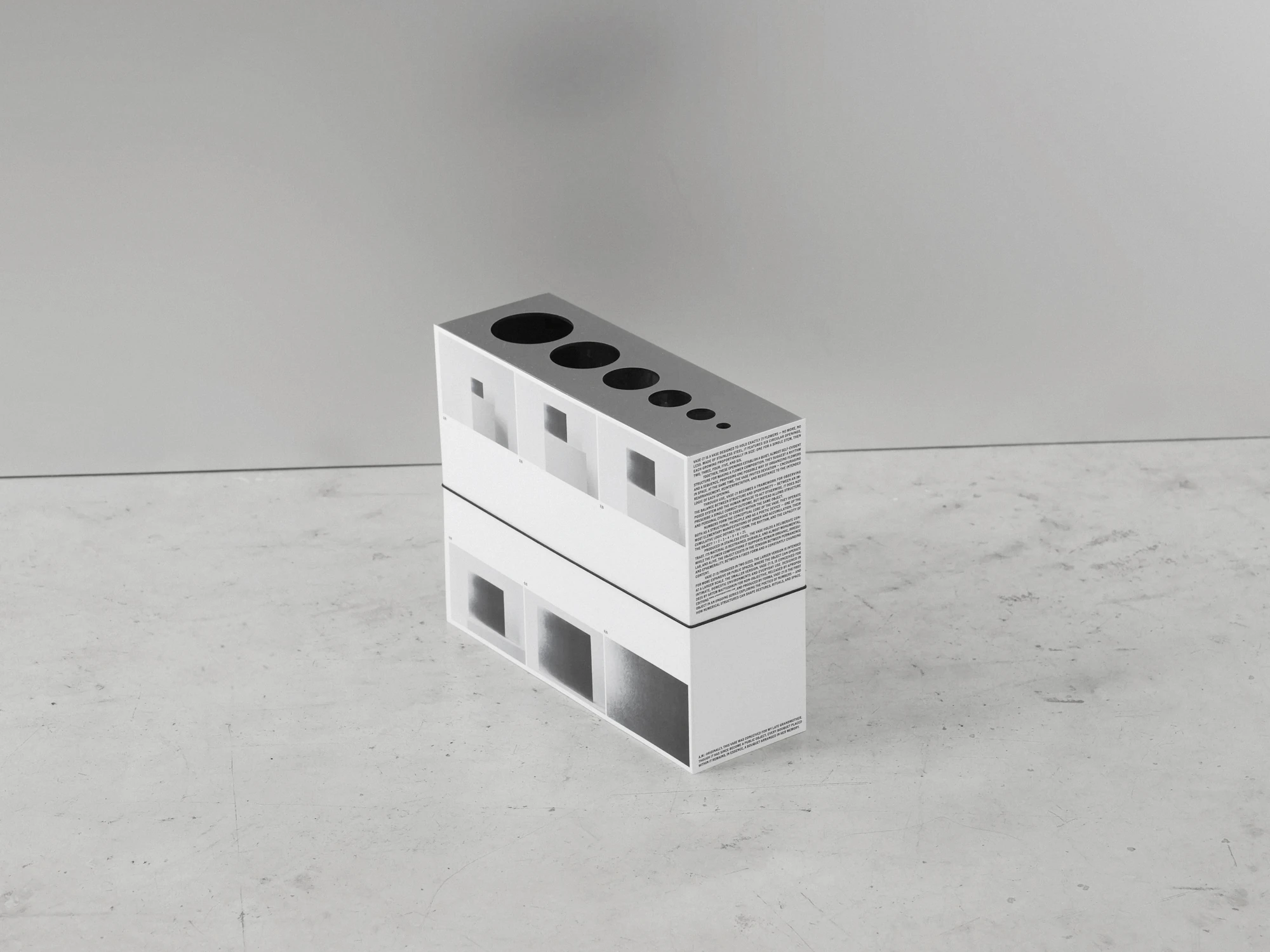 Apropos VASE-21 by Non-Objective, photographed by Elena Gavrilenko — The printed packaging of VASE-21, two cartons stacked on the floor