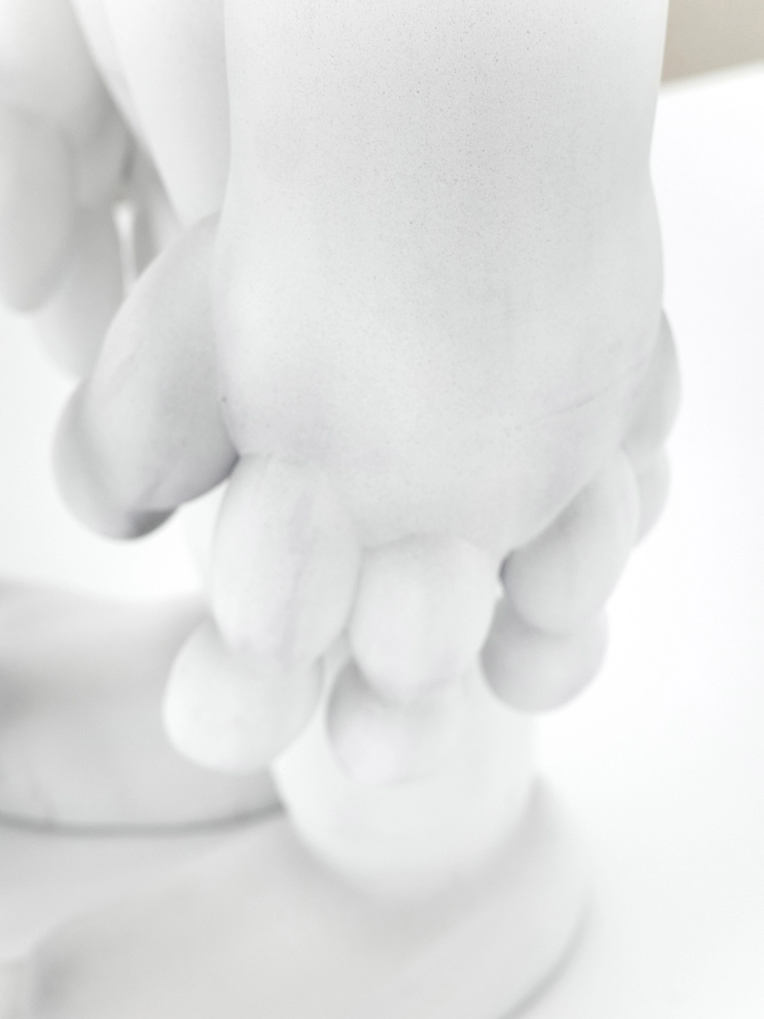 Eureka by Koesy — A close detail of two forms clasped together.