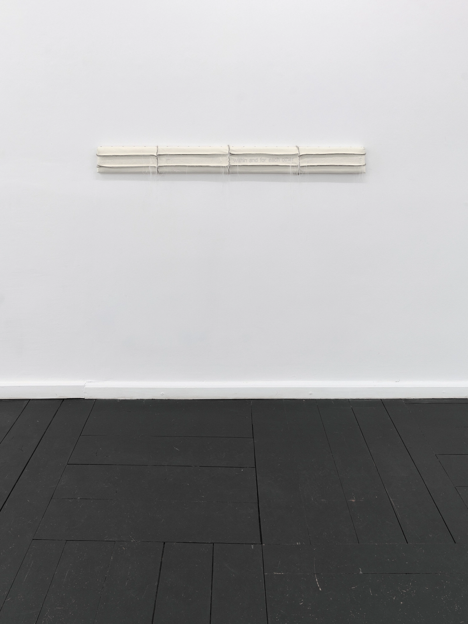 Within and For Each Other by Jan Baszak, photographed by Bartosz Górka — Relief 02 mounted horizontally on the white wall.