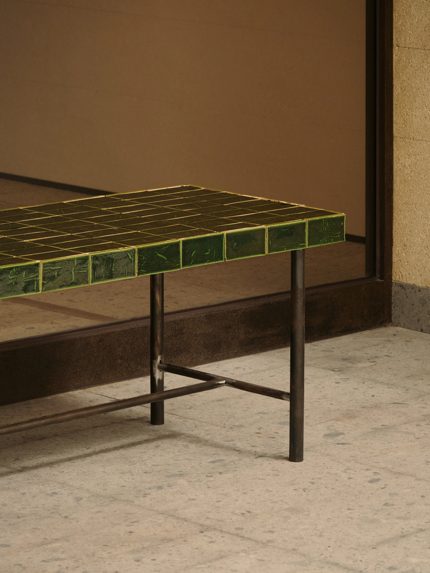 Conceived by Cotemp by ONOAA STUDIO, photographed by Jonathan Leijonhufvud — A bench on a slender frame against the shopfront glass.