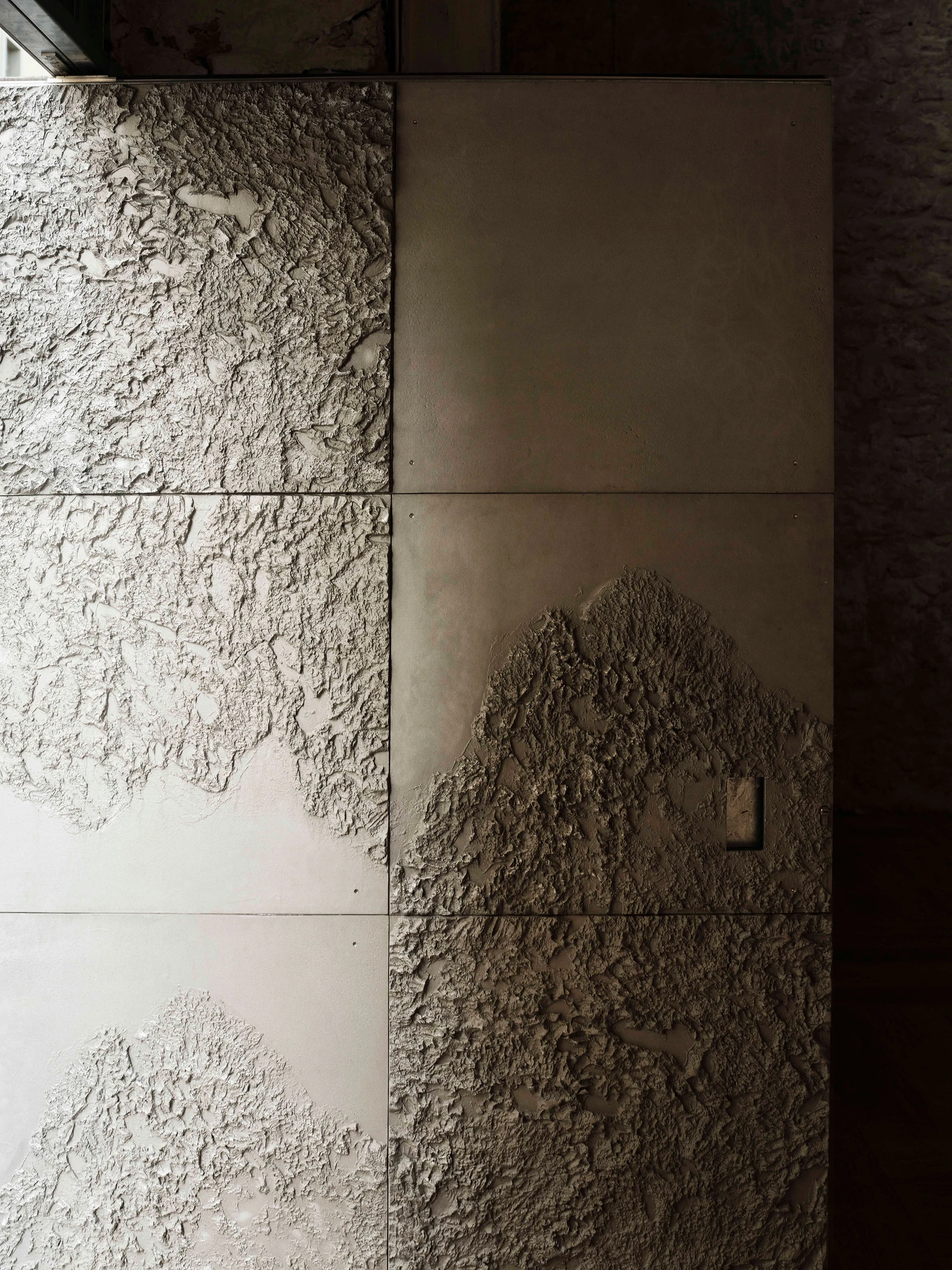 Castor Place by MPNYC, photographed by Yiorgos Kaplanidis — A close view of Stefania Strouza's cast aluminium door panels and their gridded relief of the sea floor