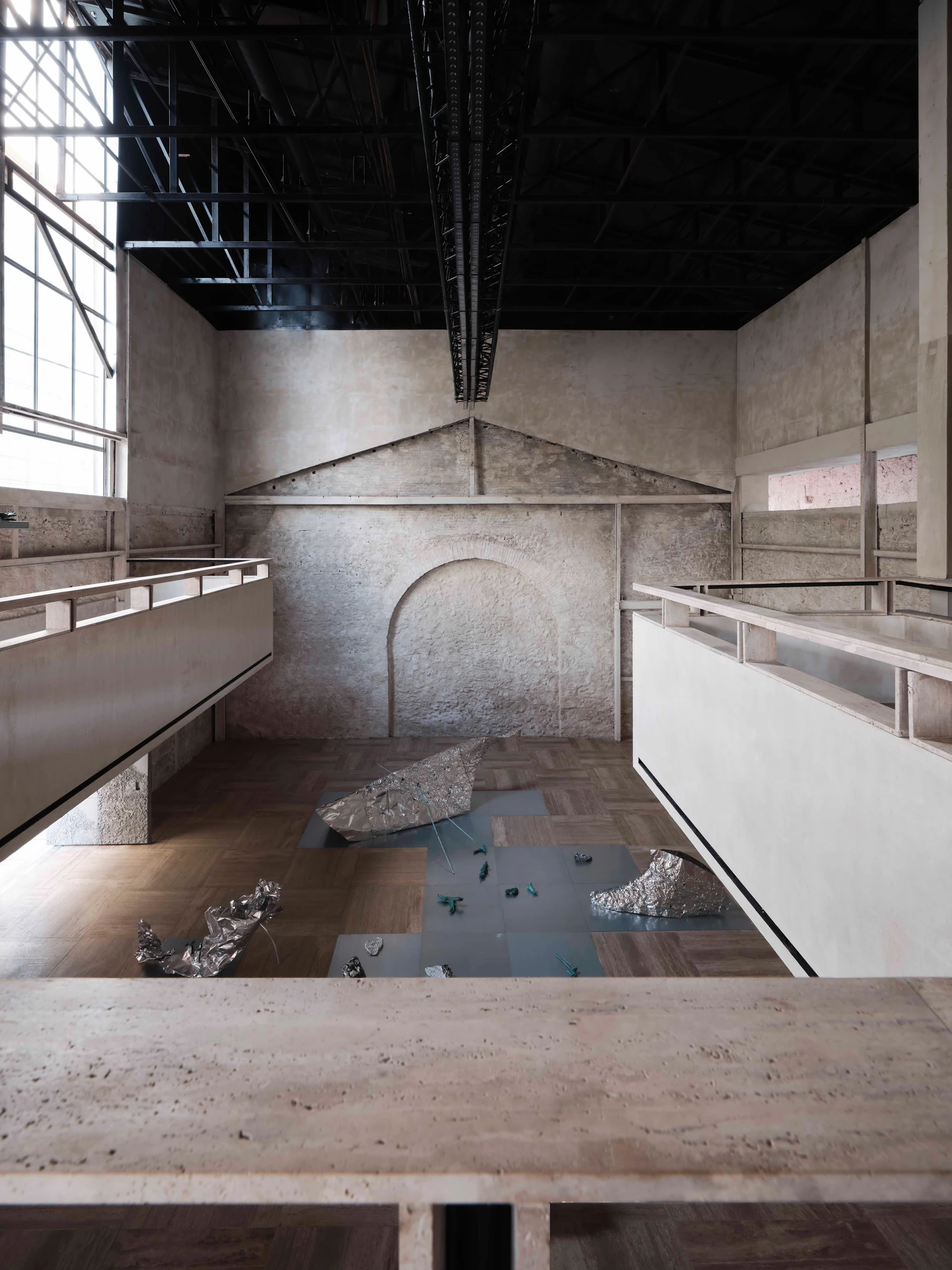 Castor Place by MPNYC, photographed by Yiorgos Kaplanidis — Installation view of Casting Water by Stefania Strouza, aluminium works seen from the mezzanine over the hall