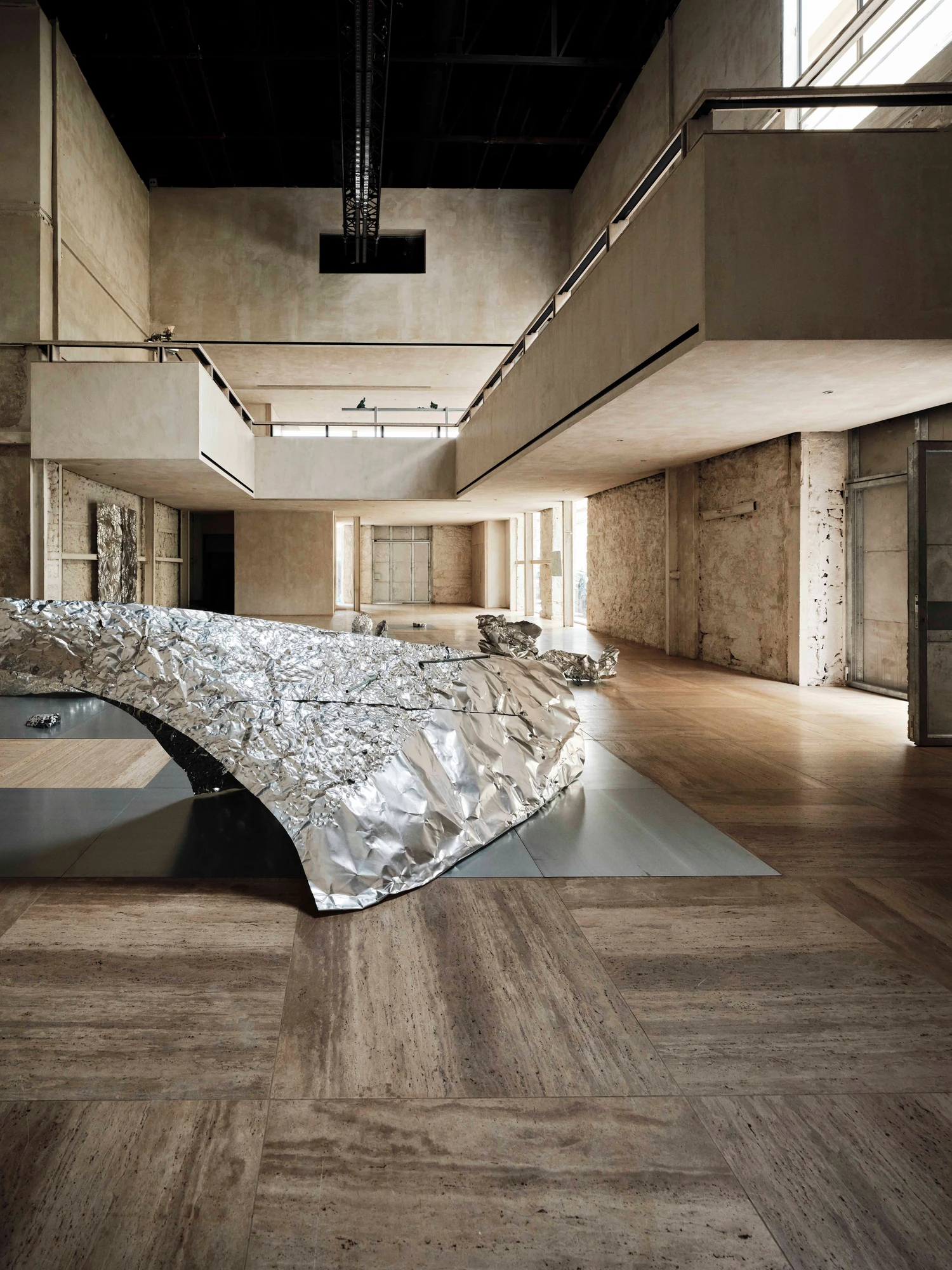 Castor Place by MPNYC, photographed by Yiorgos Kaplanidis — Installation view of Casting Water by Stefania Strouza, a large aluminium work across the hall floor