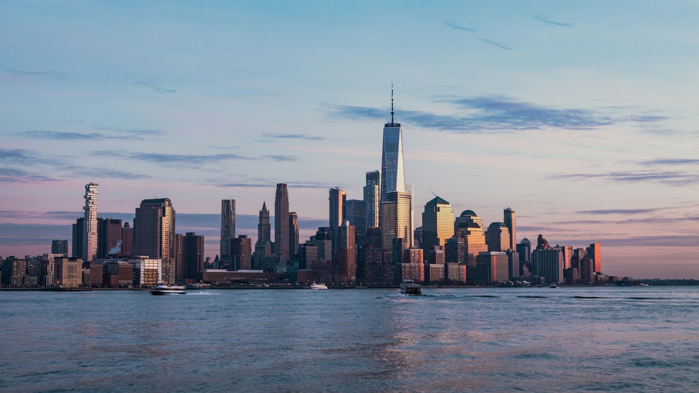 The New York City skyline across the Hudson River at dusk