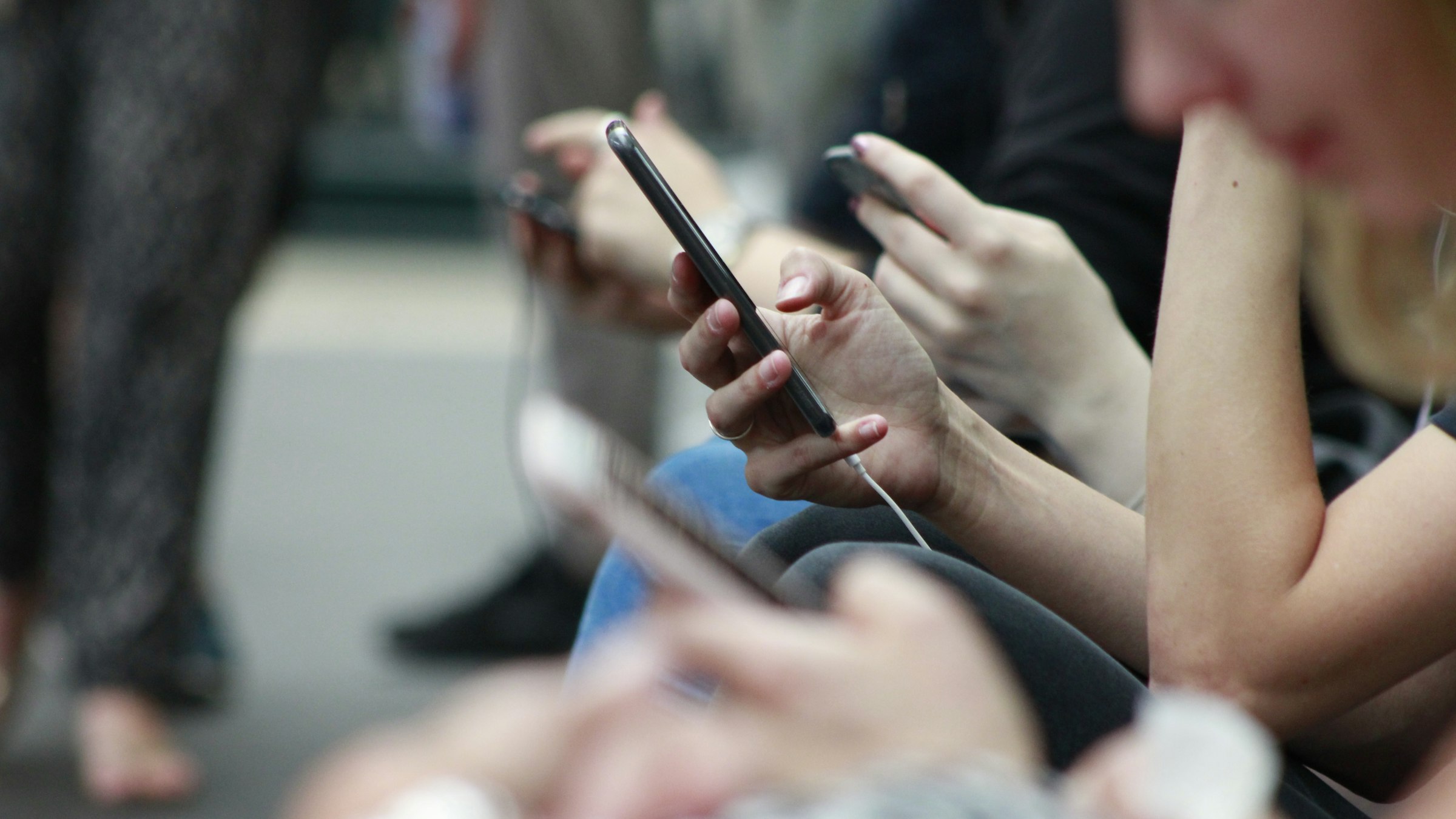People looking at their smartphones