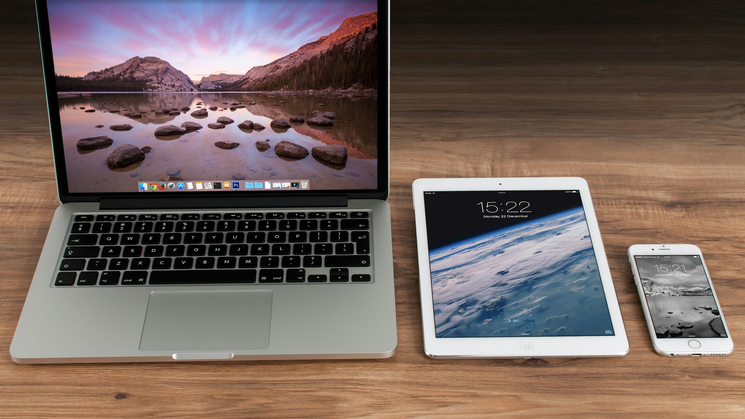 A laptop, tablet and smartphone on a desk