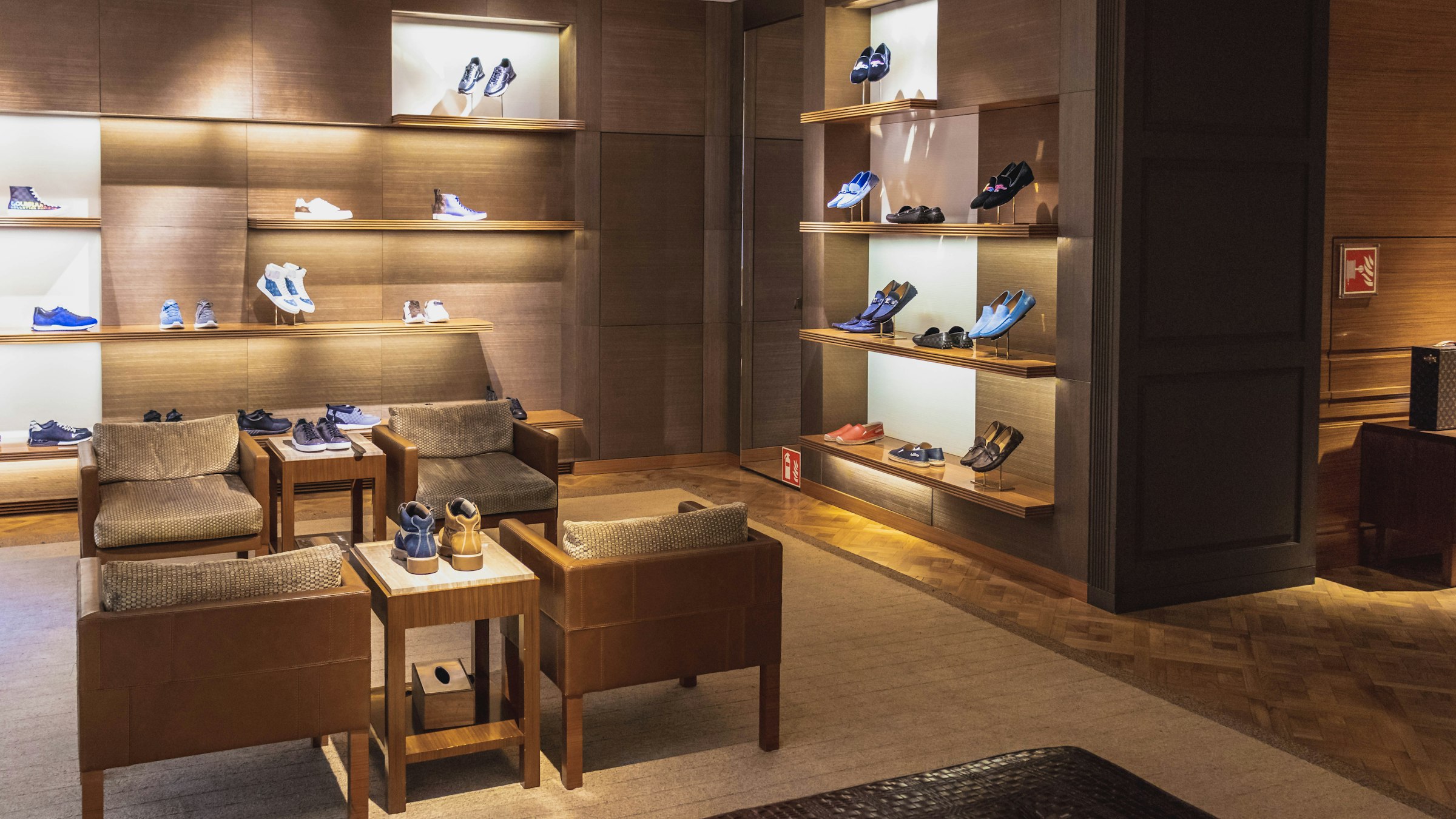 The interior of an elegant boutique with wooden shelves