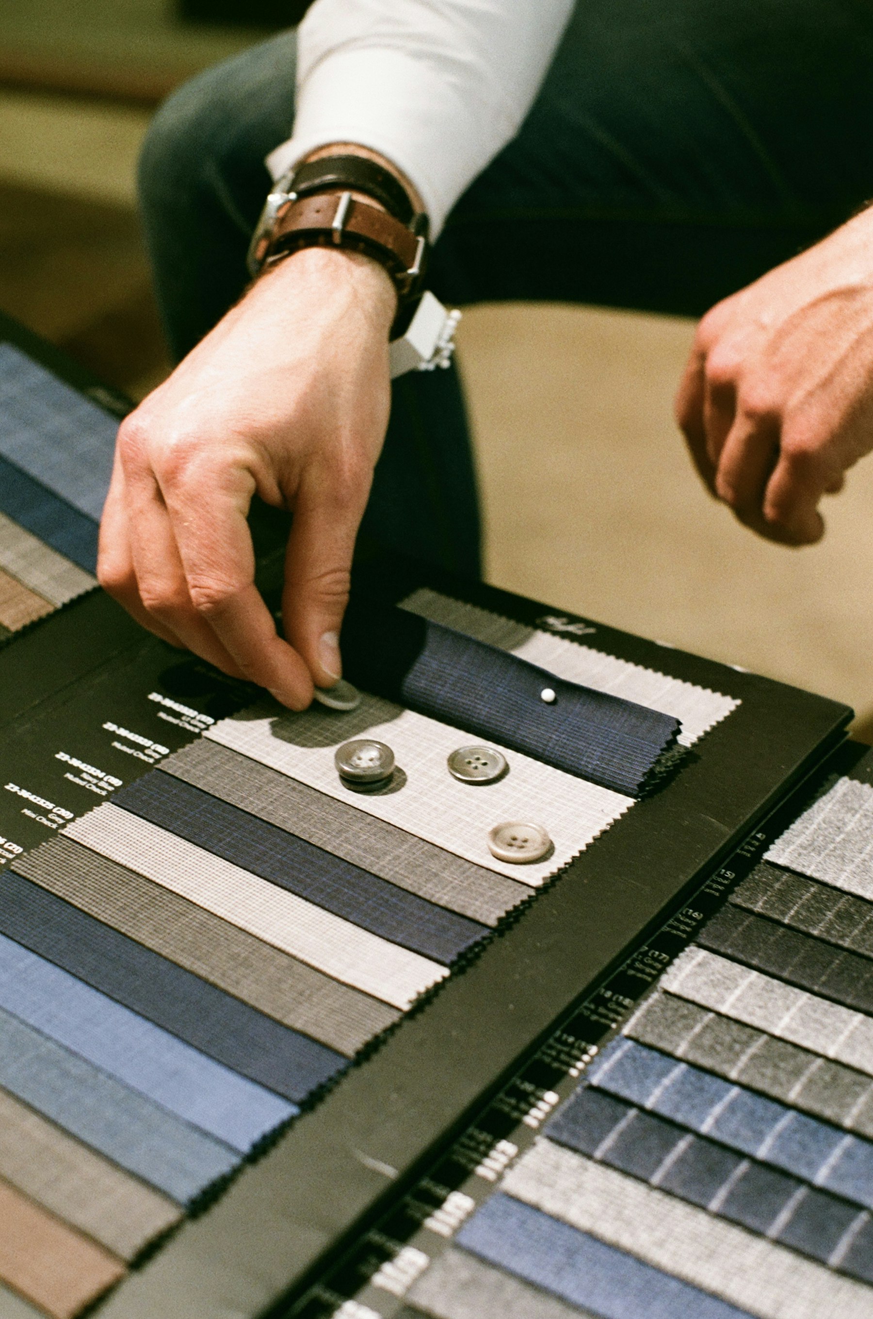 A tailor working on a piece of cloth
