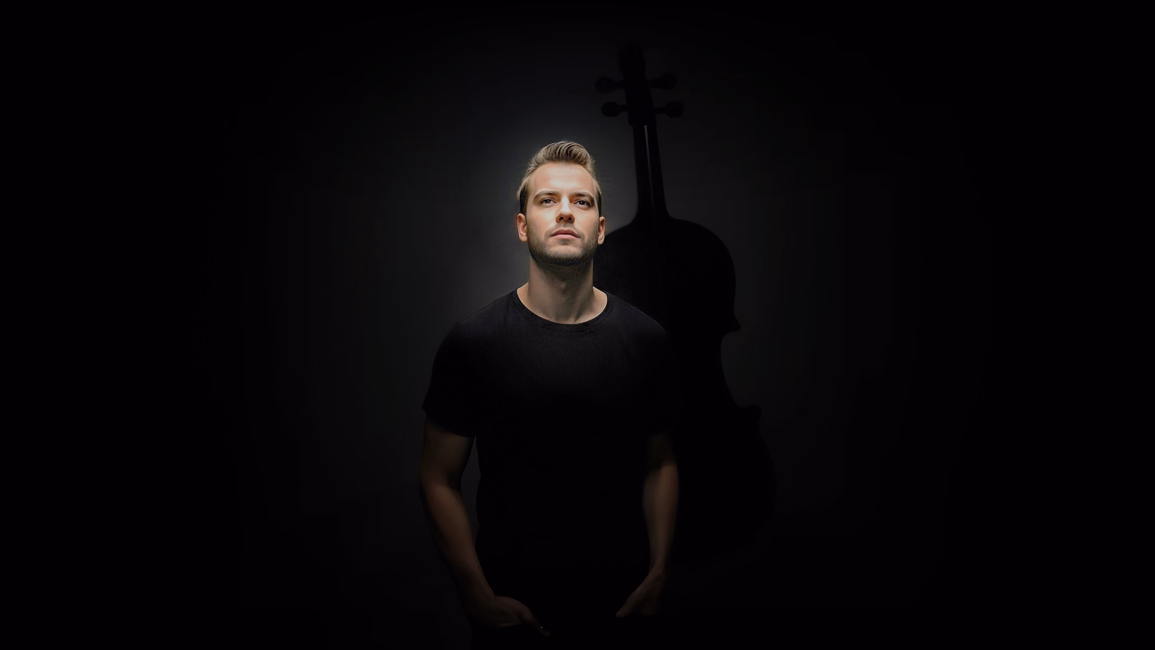 Valev Laube photographed against the shadow of a violin