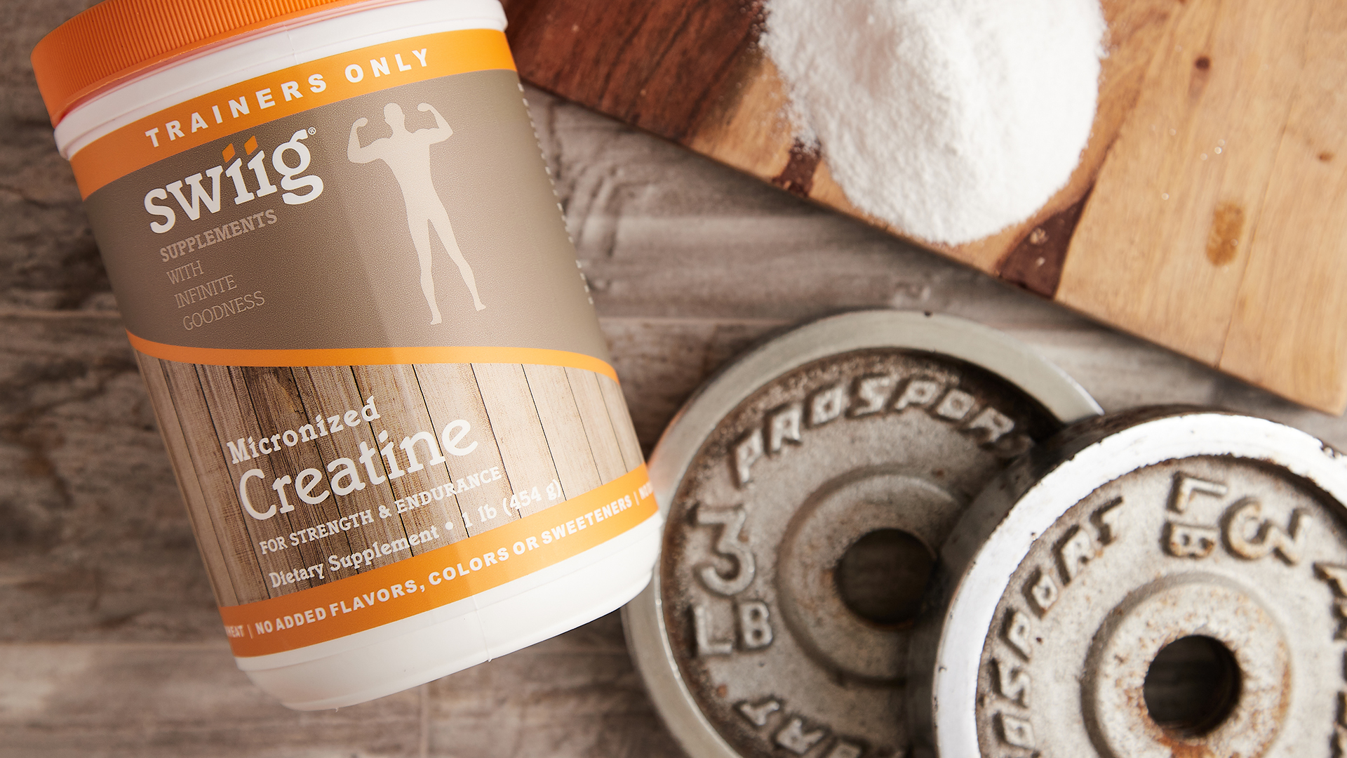 swiiig Creatine on cloth background placed next to weights