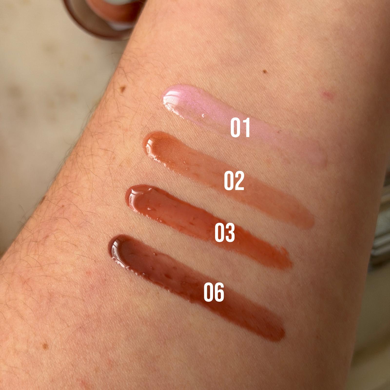 lipgloss swatches on a forearm white skin