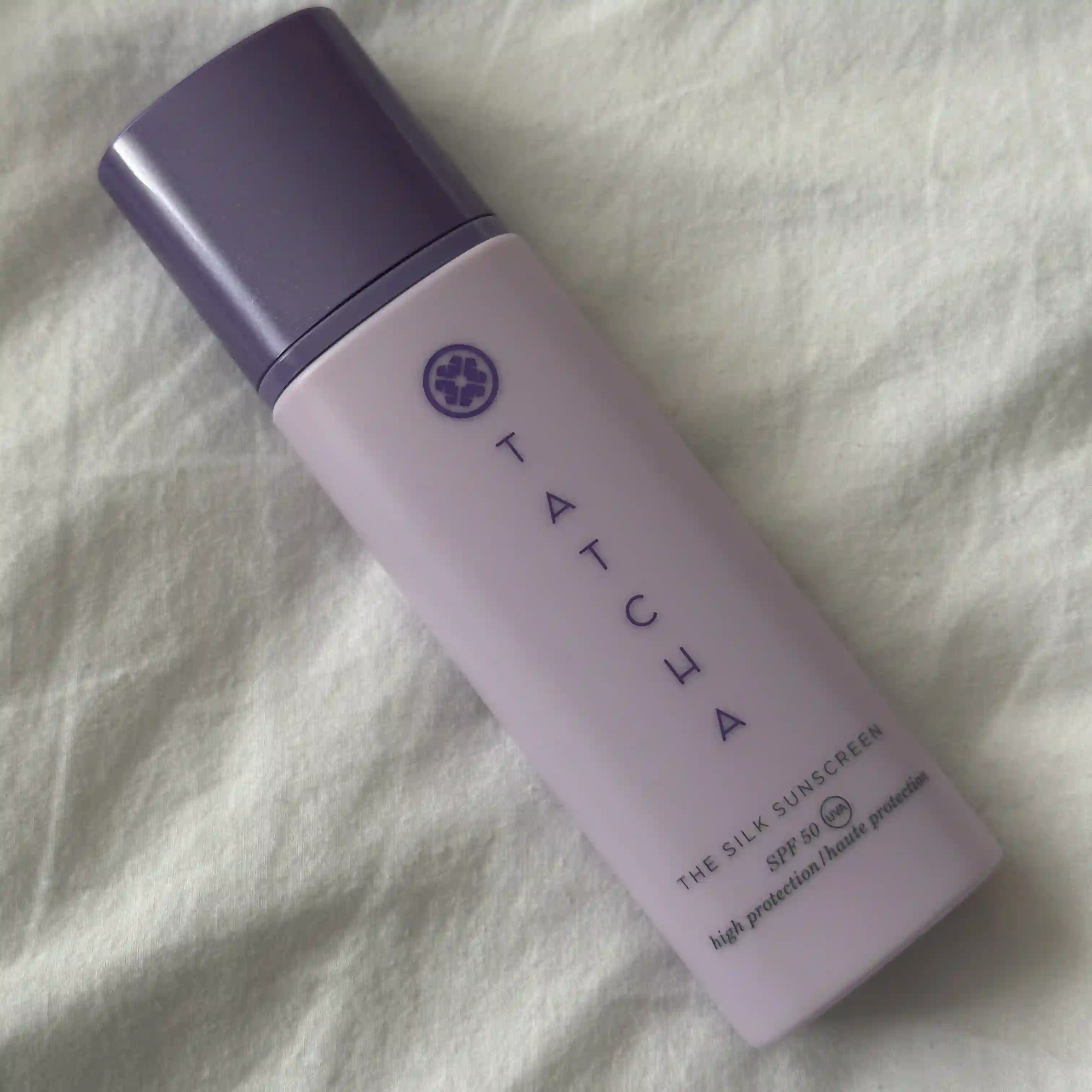 Image of Tatcha The Silk Sunscreen lying on a white sheet