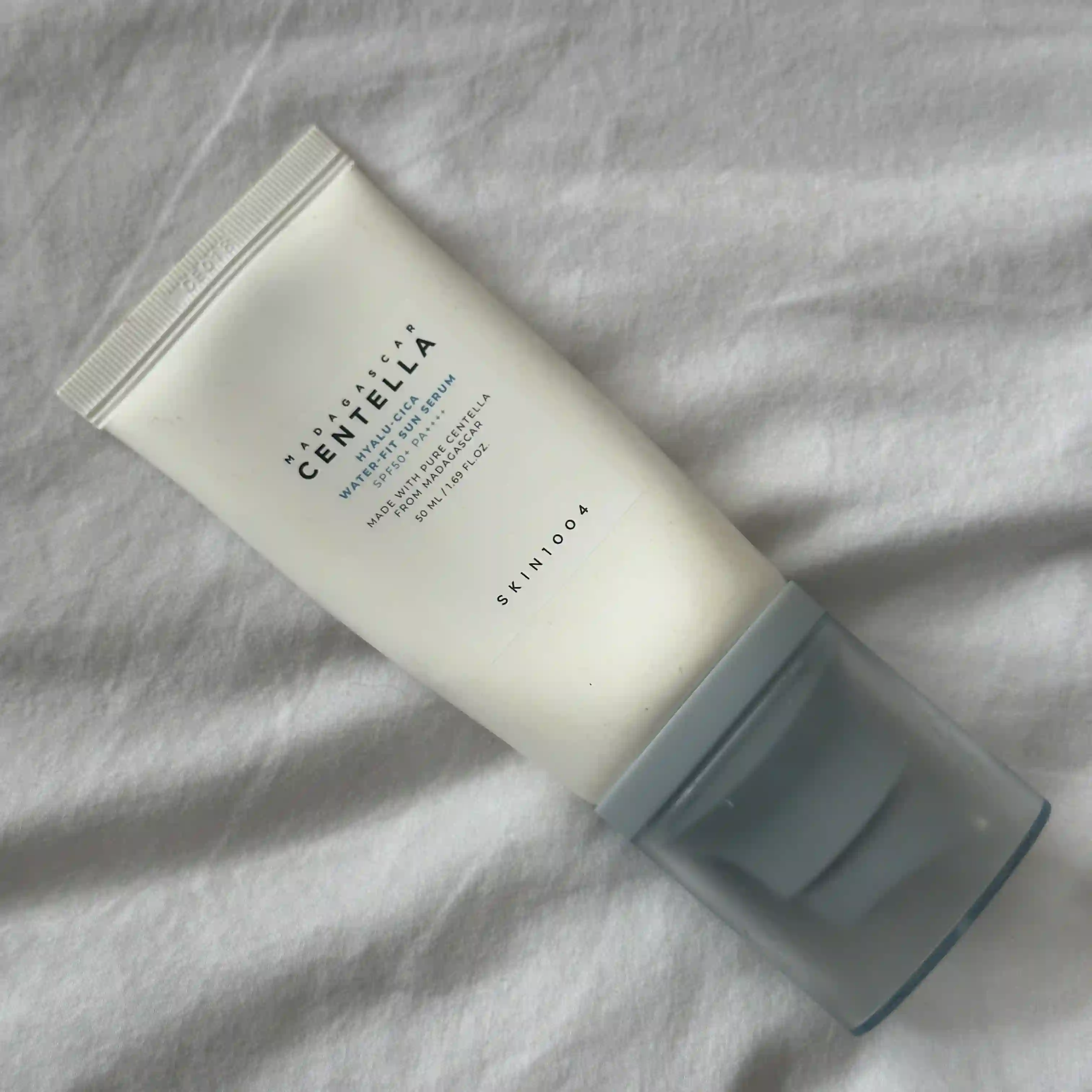 image of Skin1004 Madagascar Centella Hyalu-cica Water-fit Sun Serum laying on a white sheet