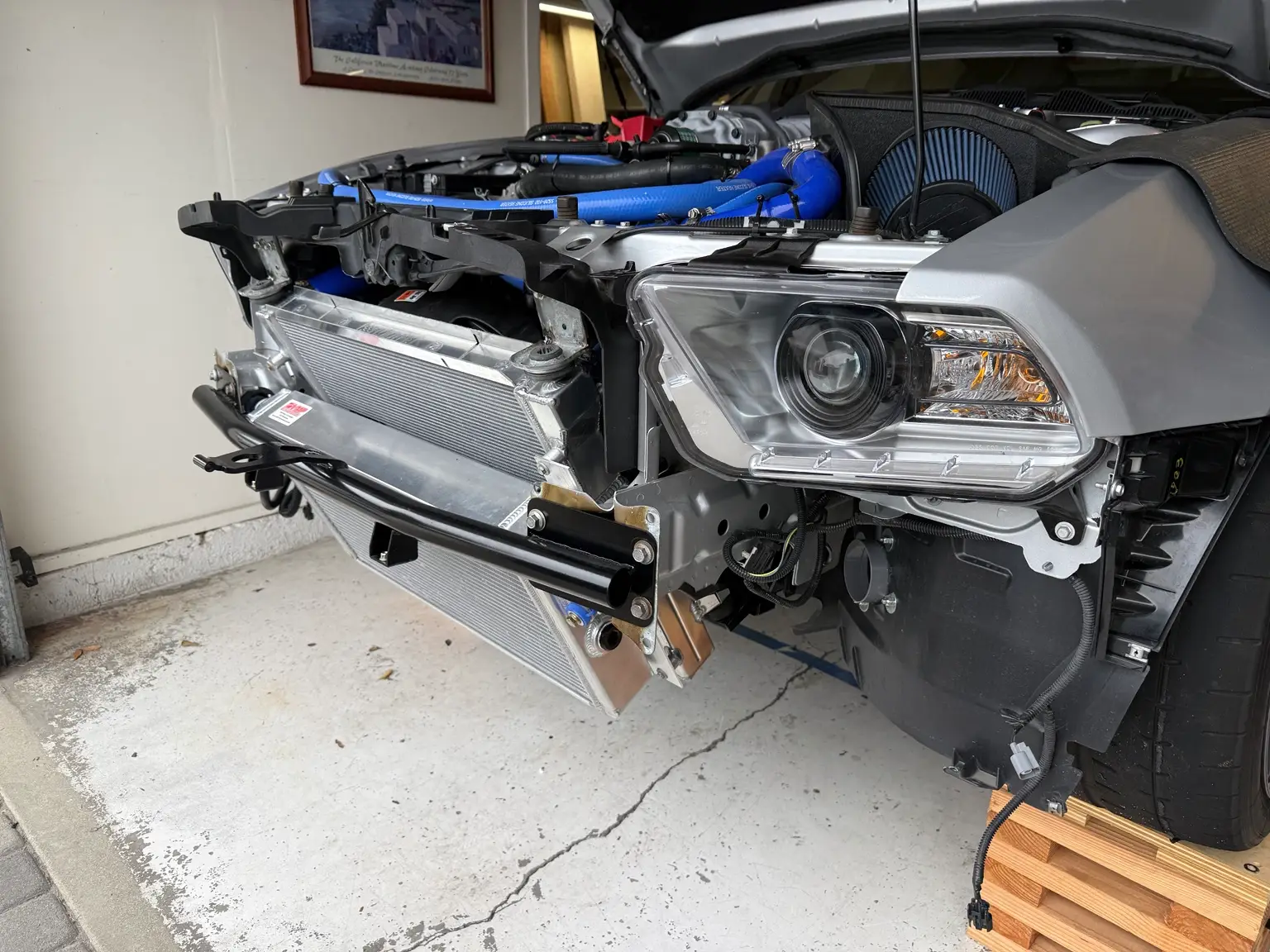 2012 Shelby GT500 with its bumper cover removed, revealing the leaned Fluidyne radiator, VMP heat exchanger and tubular bumper support.