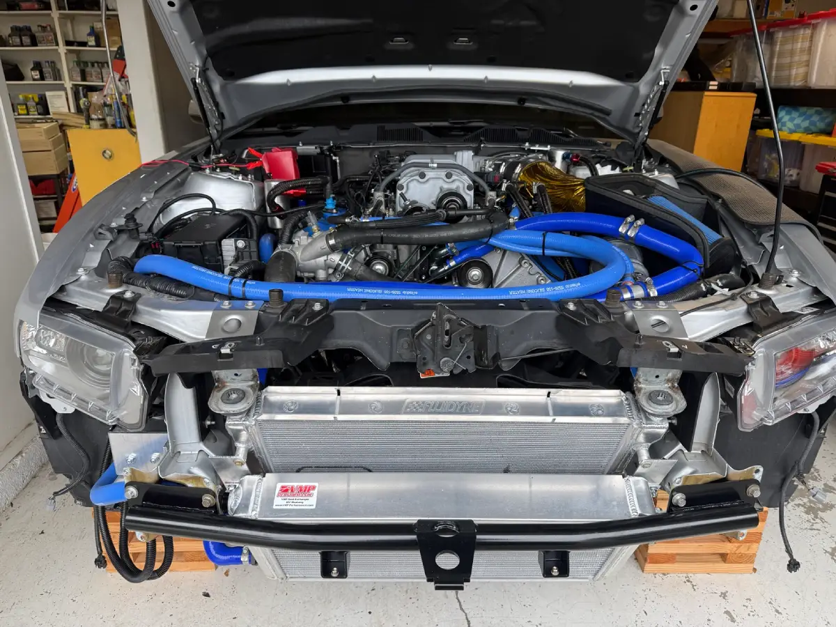 Elevated front view of the GT500 radiator and VMP heat exchanger installed behind the Ford Performance tubular bumper support.