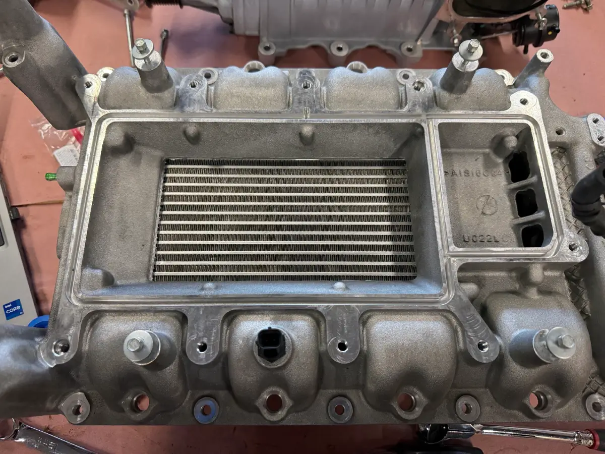 VMP intercooler installed inside the GT500 lower intake manifold before supercharger reassembly.