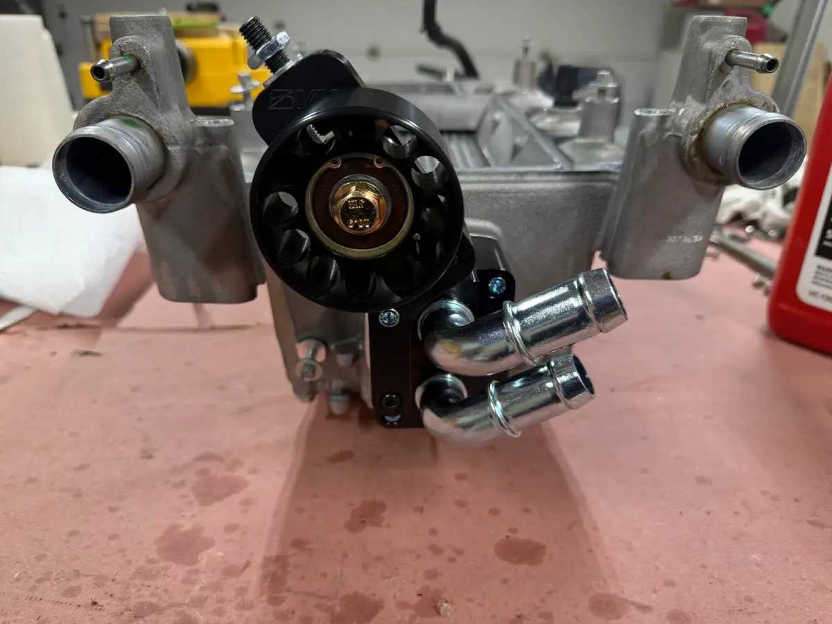 VMP 1-inch water manifold and auxiliary idler mounted on the front of the GT500 lower intake manifold.