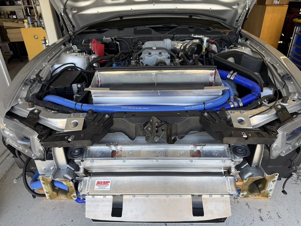 Aluminum inlet and hood-exit ducts around the VMP heat exchanger and FLUIDYNE radiator in a 2012 GT500.