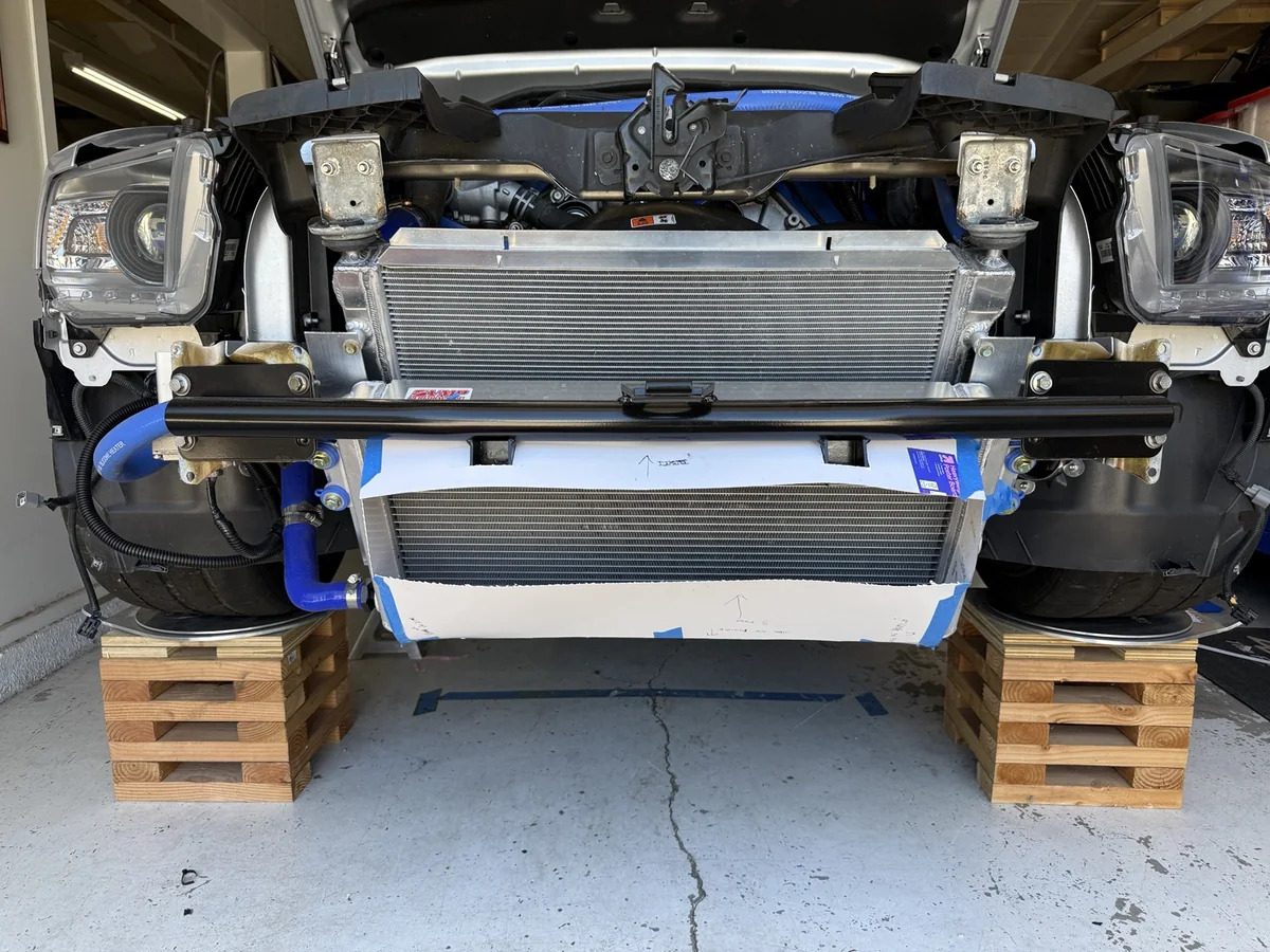 Front inlet duct templates fitted to a GT500 heat exchanger beneath the tubular bumper bar.