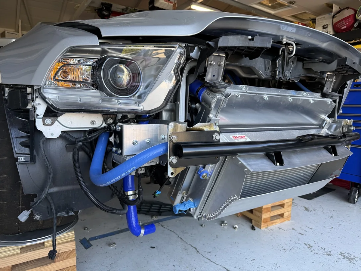 Completed aluminum inlet duct around a VMP heat exchanger behind the GT500 tubular bumper bar.