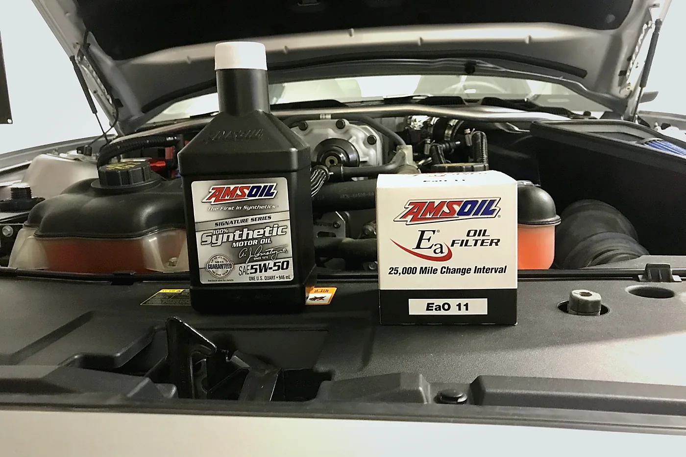 AMSOIL 5W-50 synthetic motor oil and AMSOIL oil filter used during a real vehicle oil change
