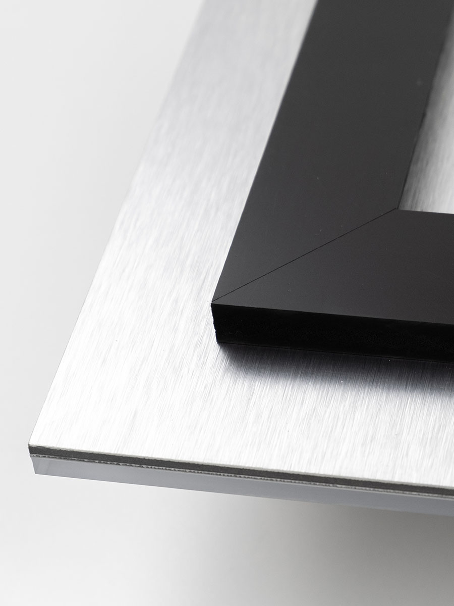 Close-up of the inset float mount and hanging cleat on the back of an acrylic print