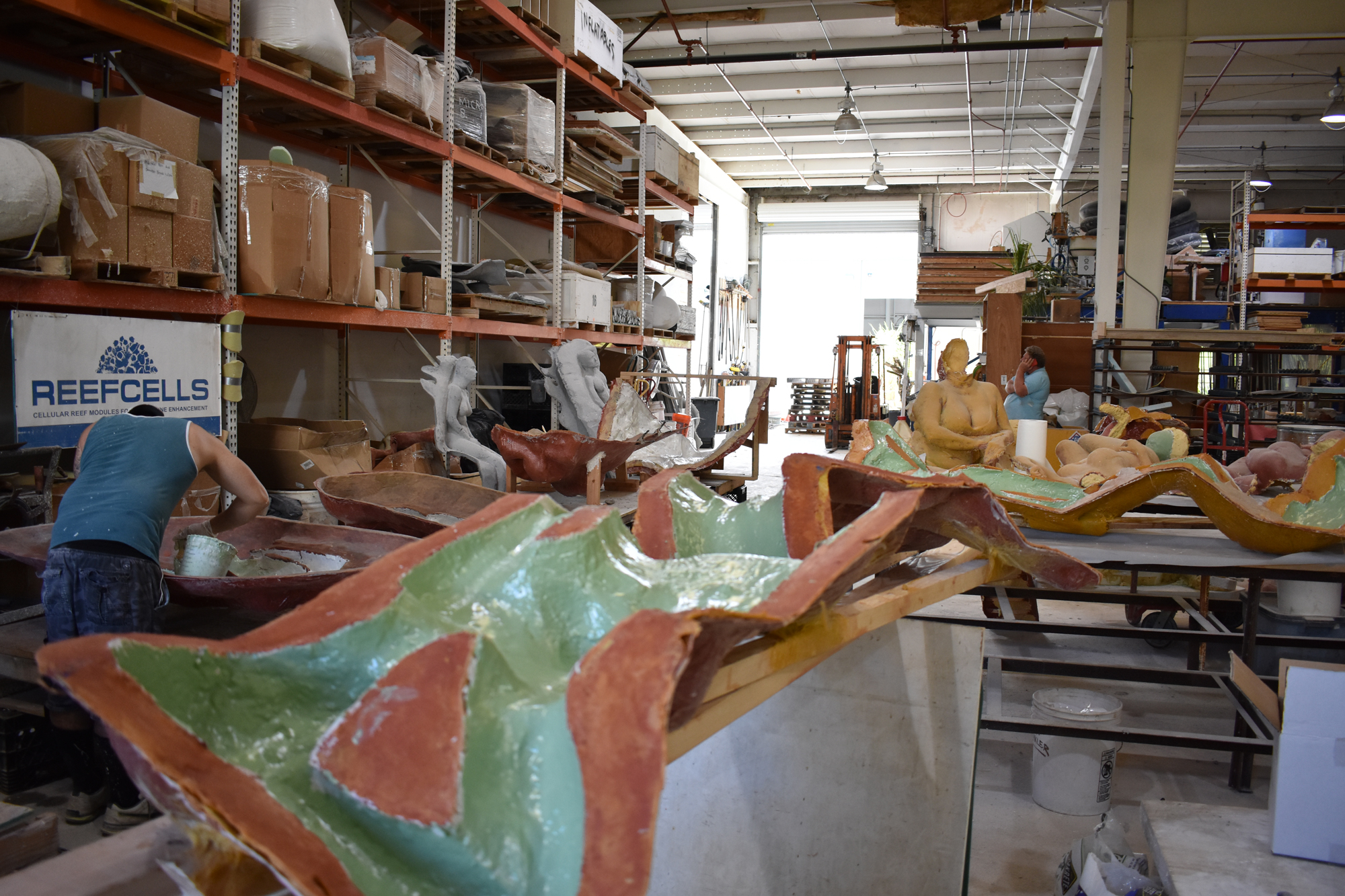 A worker working on mermaid casts