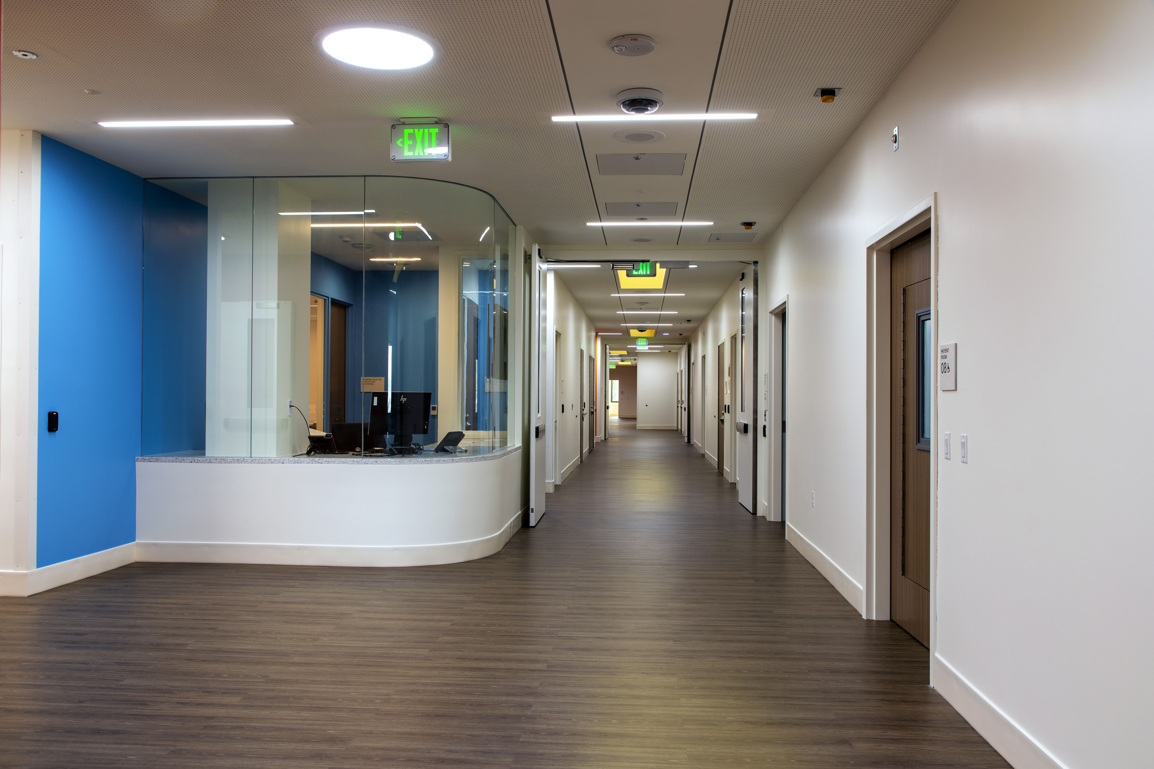 Sutter Health CPMC Davies Campus Behavioral Health Renovations, San Francisco: healthcare renovation by Herrero Builders in an occupied hospital, with OCULUS Architects. Interior view of the corridor and glass-enclosed nurse station.