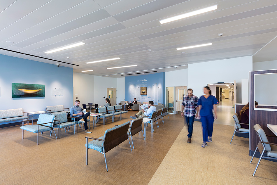 Adventist Health UVMC Ukiah Valley ED Expansion & ICU Addition, Ukiah, CA: Healthcare renovation, tenant improvement and new construction by Herrero Builders in an occupied environment, with Lionakis. Interior view of a public waiting area with blue seating.