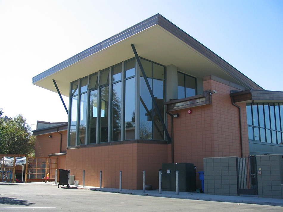 Congregation Netivot Shalom Synagogue & Day School, Berkeley, CA: Education and Religious renovation and tenant improvement by Herrero Builders with significant demolition, with David Finn Architects. Exterior view of the side elevation with a glazed corner and wide overhanging roof.