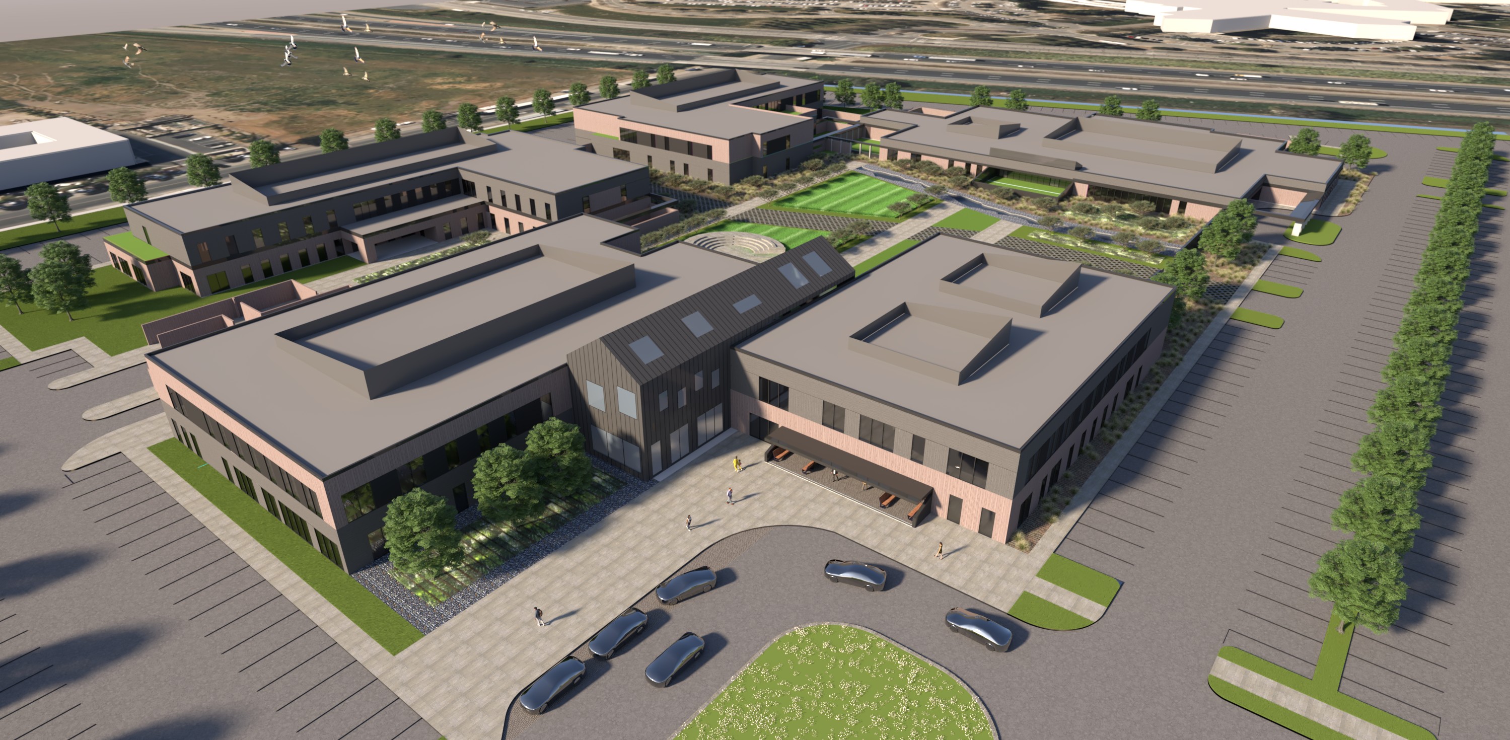 San Joaquin County BeWell Behavioral Health Campus, French Camp, CA: Healthcare new construction by Herrero Builders under Progressive Design Build, with kmd architects. Aerial view of the campus buildings, parking and landscaped courtyard from the entrance side in a rendering.