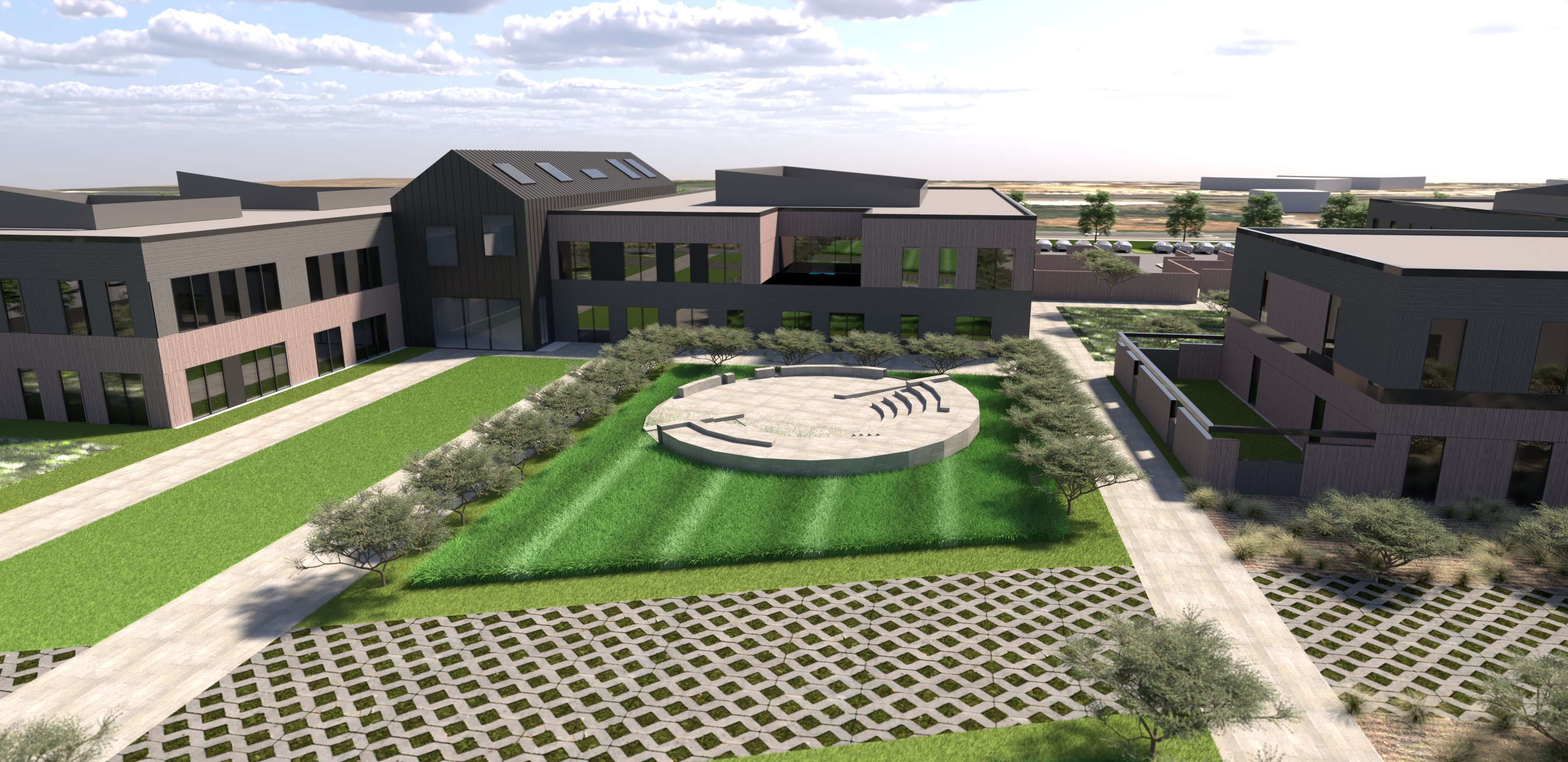 San Joaquin County BeWell Behavioral Health Campus, French Camp, CA: Healthcare new construction by Herrero Builders under Progressive Design Build, with kmd architects. Aerial view of a central courtyard with an amphitheater, striped lawn and permeable paving in a rendering.