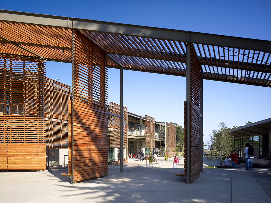 Nueva School Hillside Learning Complex & Historic Crocker Mansion, Hillsborough, CA: Education and Historic new construction and renovation by Herrero Builders earning LEED Gold, with Leddy Maytum Stacy Architects. Exterior view of a steel pergola with louvered timber panels over a plaza.