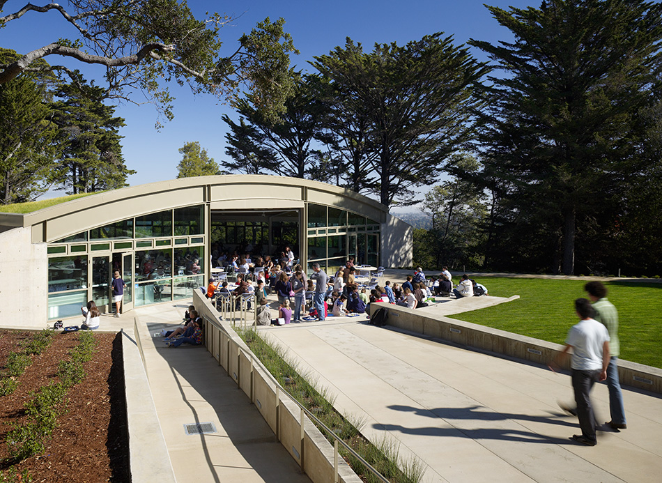Nueva School Hillside Learning Complex & Historic Crocker Mansion, Hillsborough, CA: Education and Historic new construction and renovation by Herrero Builders earning LEED Gold, with Leddy Maytum Stacy Architects. Exterior view of a curved-roof building with large glazing and a green roof edge.