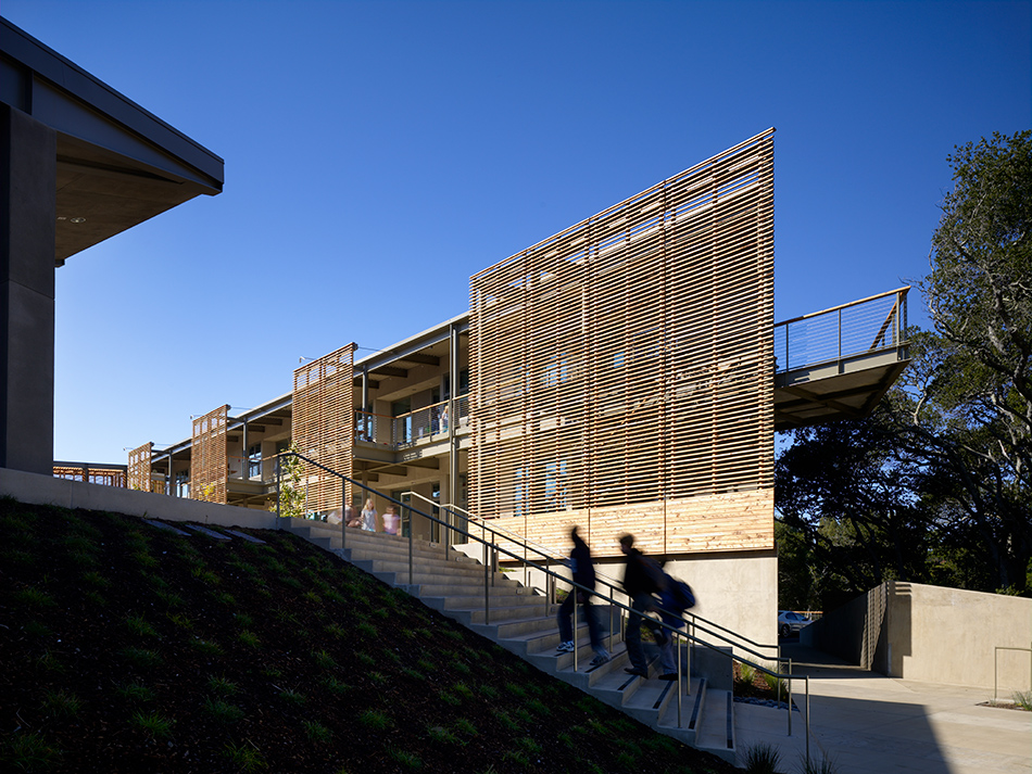 Nueva School Hillside Learning Complex & Historic Crocker Mansion, Hillsborough, CA: Education and Historic new construction and renovation by Herrero Builders earning LEED Gold, with Leddy Maytum Stacy Architects. Exterior view of a timber slat facade above a concrete stair.