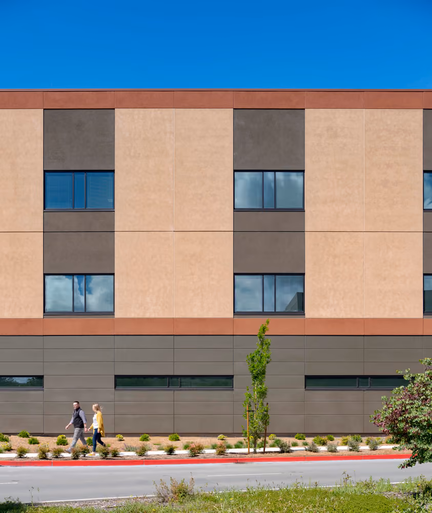 Sutter Health Santa Rosa Regional Hospital Expansion, Santa Rosa, CA: Healthcare New Construction by Herrero Builders under Integrated Project Delivery with Lean construction, with Stantec. Exterior view of the expansion facade panels with punched windows above a street sidewalk.