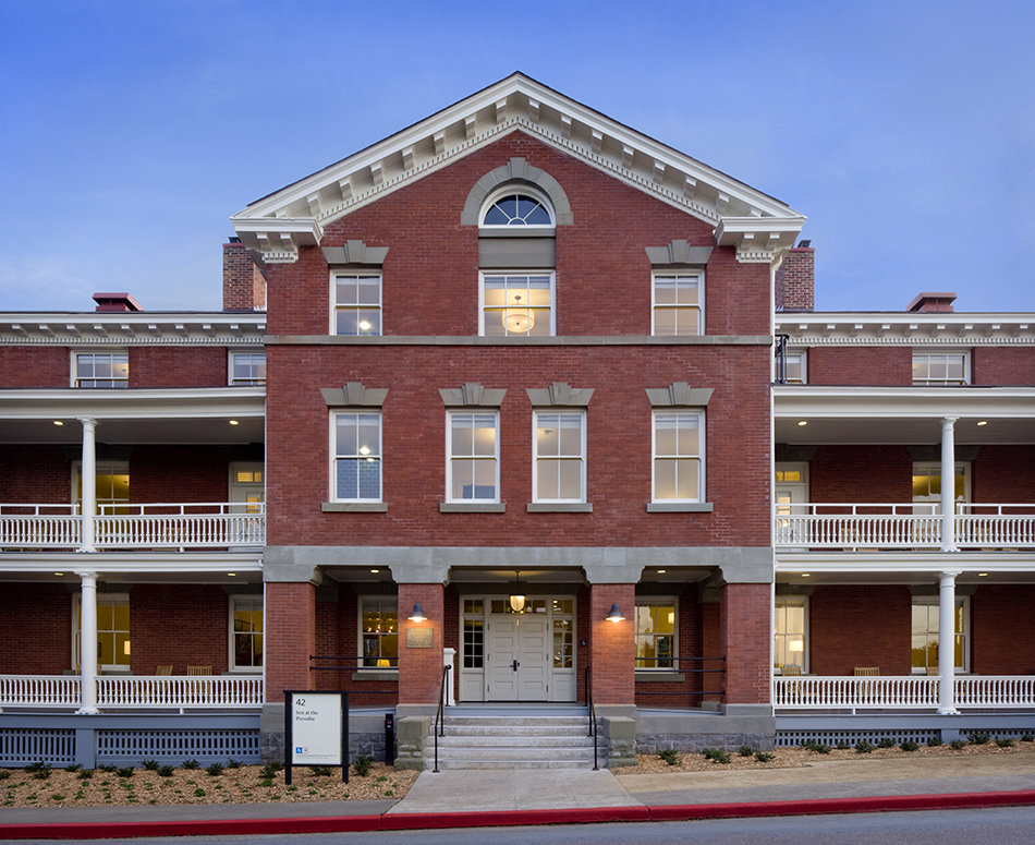 The Presidio Trust Inn at the Presidio, San Francisco, CA: Hospitality and Historic renovation by Herrero Builders preserving a National Historic Landmark, with Architectural Resources Group. Exterior view of the central pedimented entrance with an arched window and front steps.